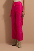 Fuchsia crushed silk hand block printed pants, highlighted with multi colored thread embroidery.