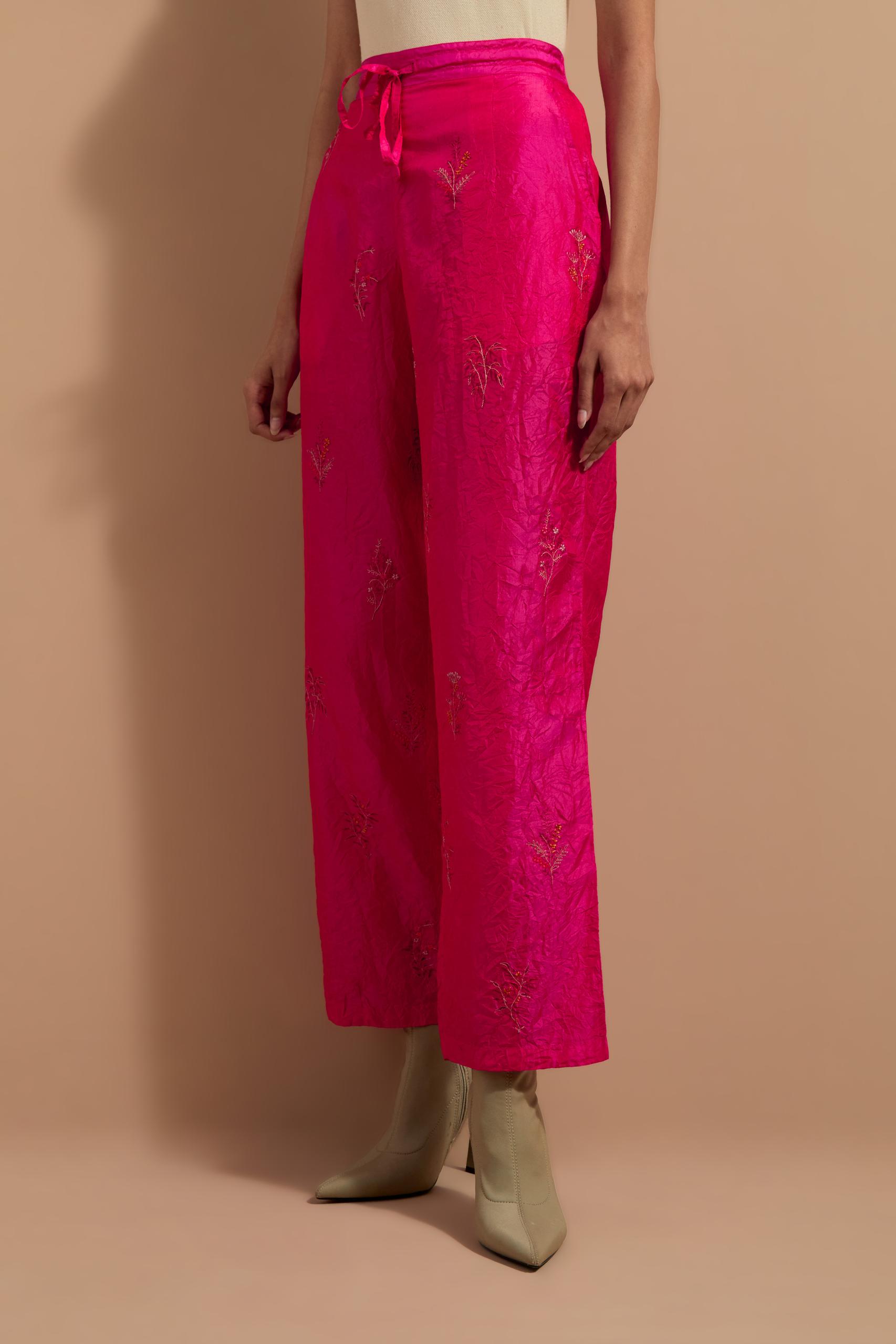 Fuchsia crushed silk hand block printed pants, highlighted with multi colored thread embroidery.