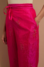 Fuchsia crushed silk hand block printed pants, highlighted with multi colored thread embroidery.
