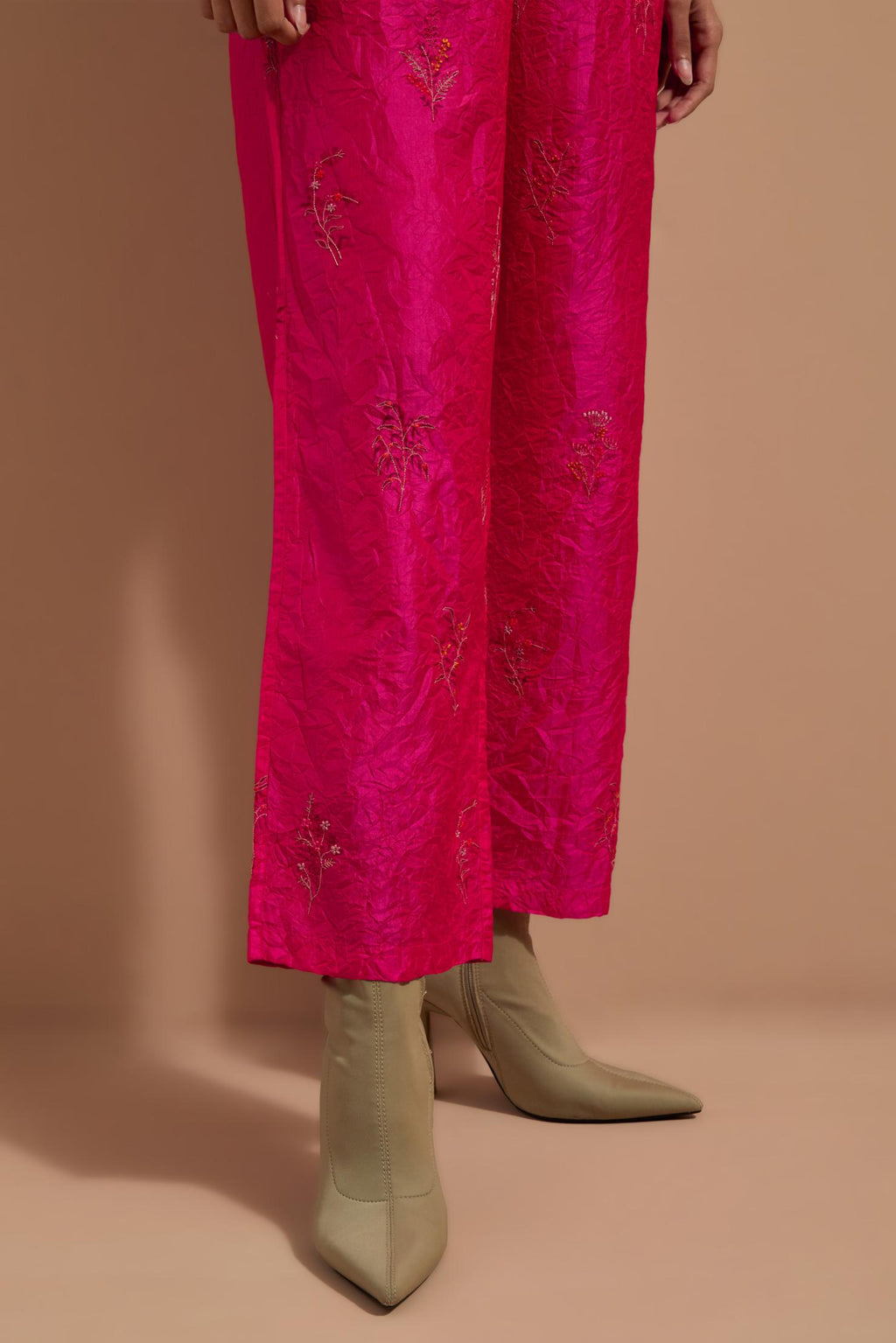 Fuchsia crushed silk hand block printed pants, highlighted with multi colored thread embroidery.