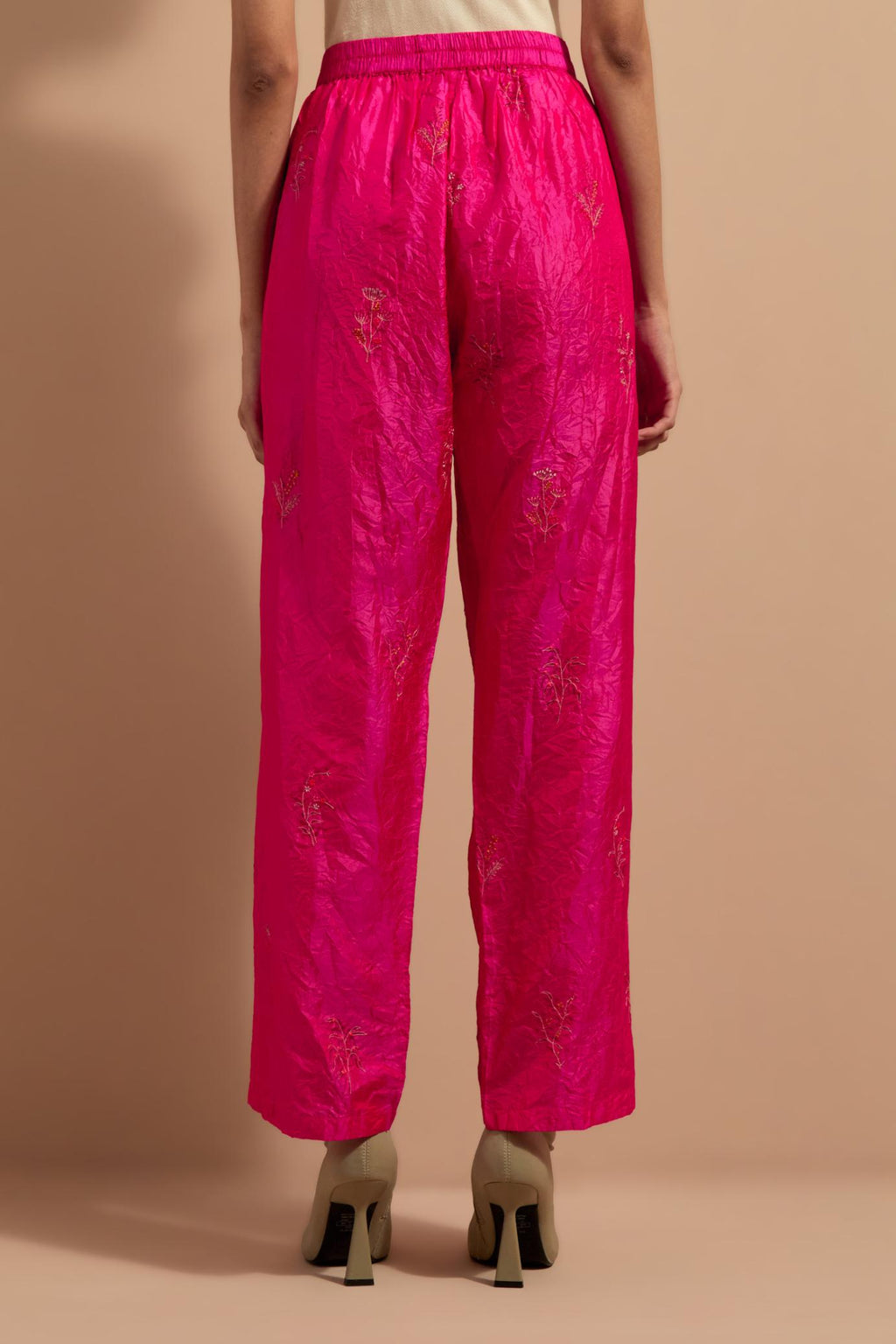 Fuchsia crushed silk hand block printed pants, highlighted with multi colored thread embroidery.