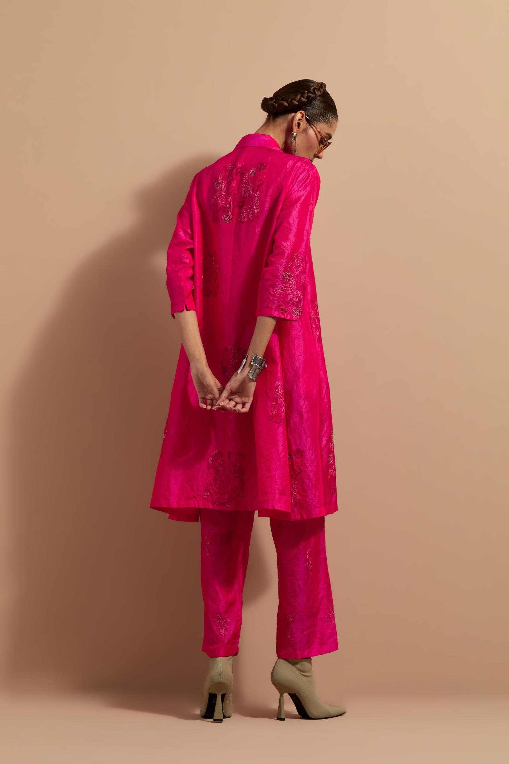Fuchsia crushed silk A-line short kurta set with hand block print, highlighted with multi colored thread embroidery.