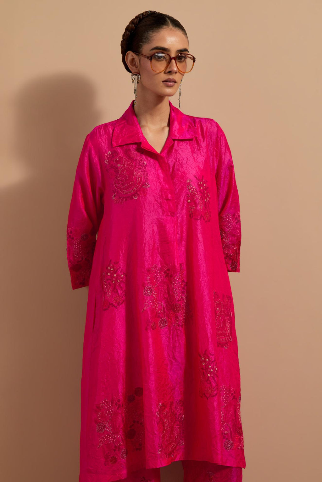 Fuchsia crushed silk A-line short kurta set with hand block print, highlighted with multi colored thread embroidery.