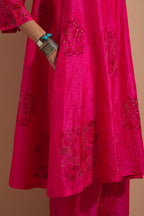 Fuchsia crushed silk A-line short kurta set with hand block print, highlighted with multi colored thread embroidery.