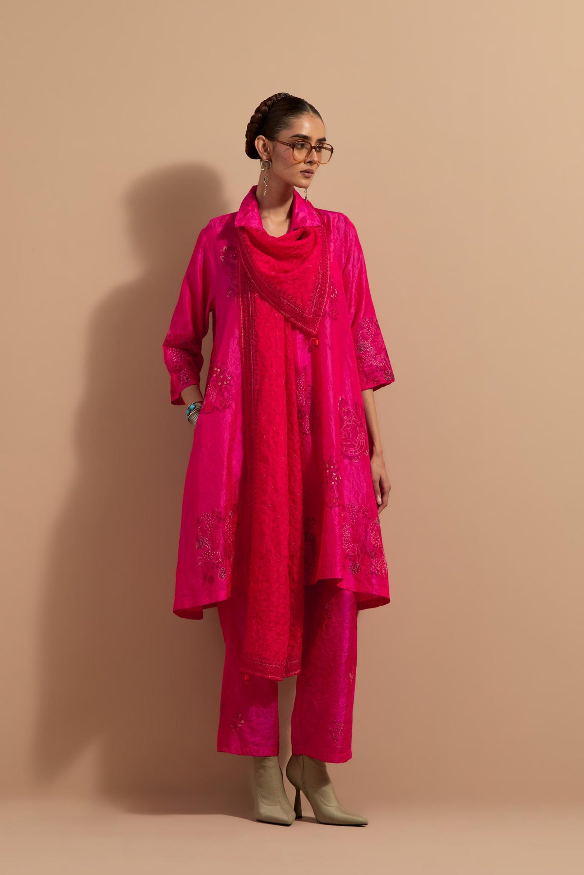 Fuchsia crushed silk A-line short kurta set with hand block print, highlighted with multi colored thread embroidery.