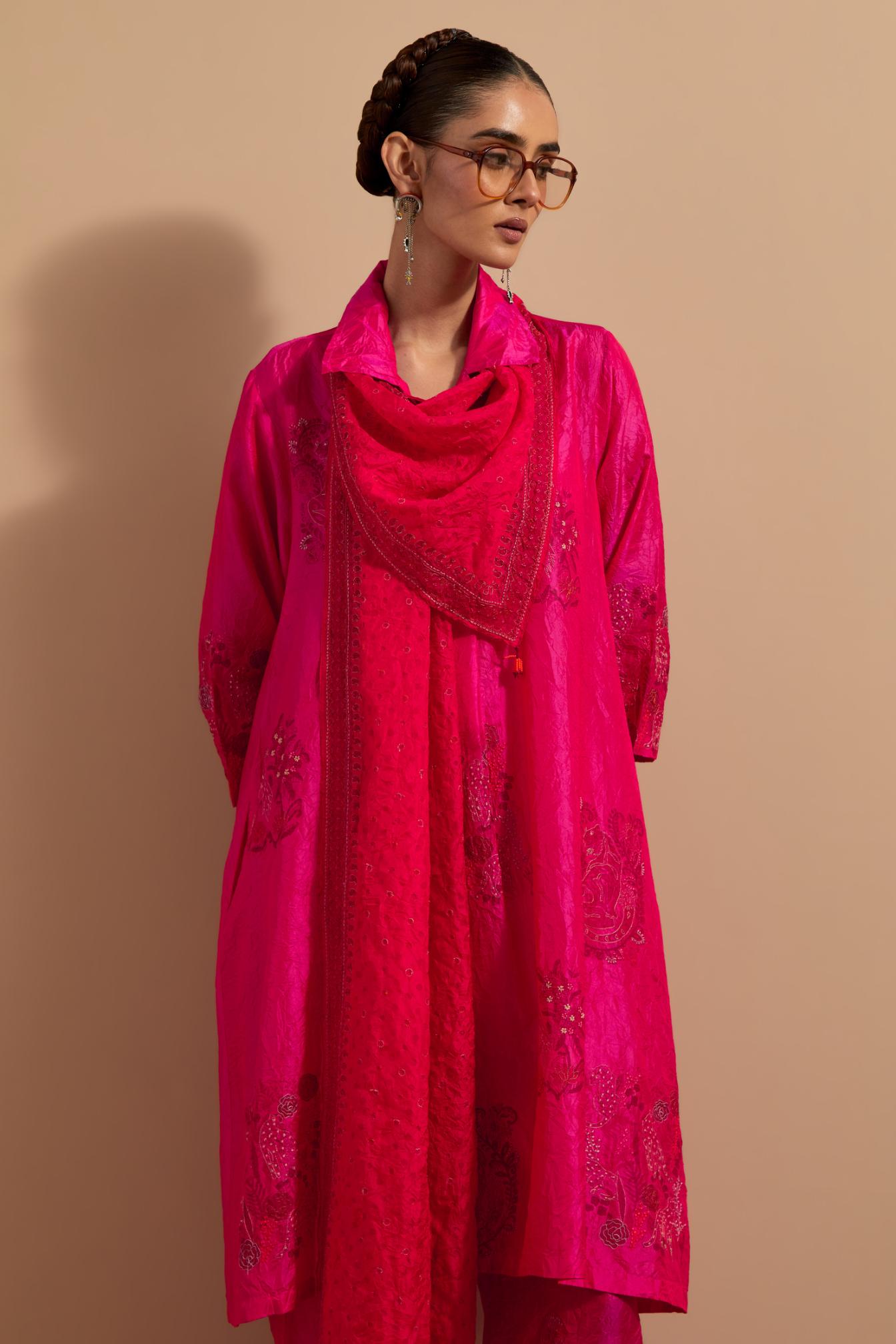 Fuchsia crushed silk A-line short kurta set with hand block print, highlighted with multi colored thread embroidery.