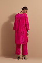 Fuchsia crushed silk short kurta set with hand block print, highlighted with multi colored thread embroidery.