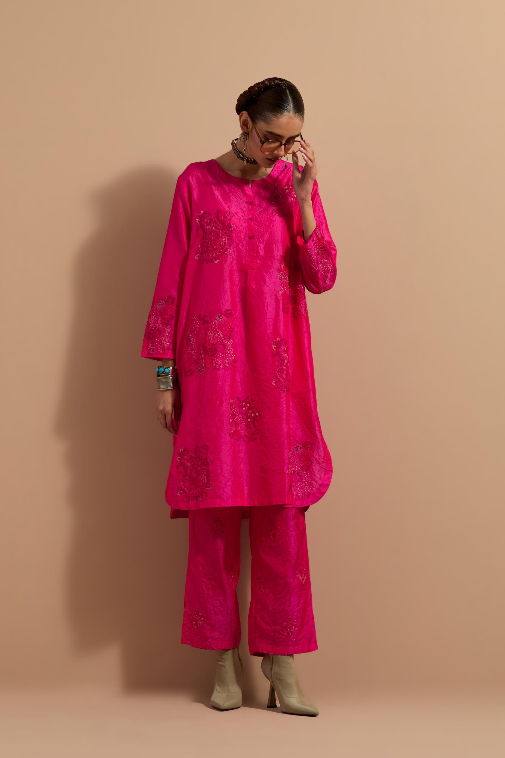 Fuchsia crushed silk short kurta set with hand block print, highlighted with multi colored thread embroidery.