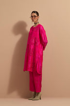 Fuchsia crushed silk short kurta set with hand block print, highlighted with multi colored thread embroidery.