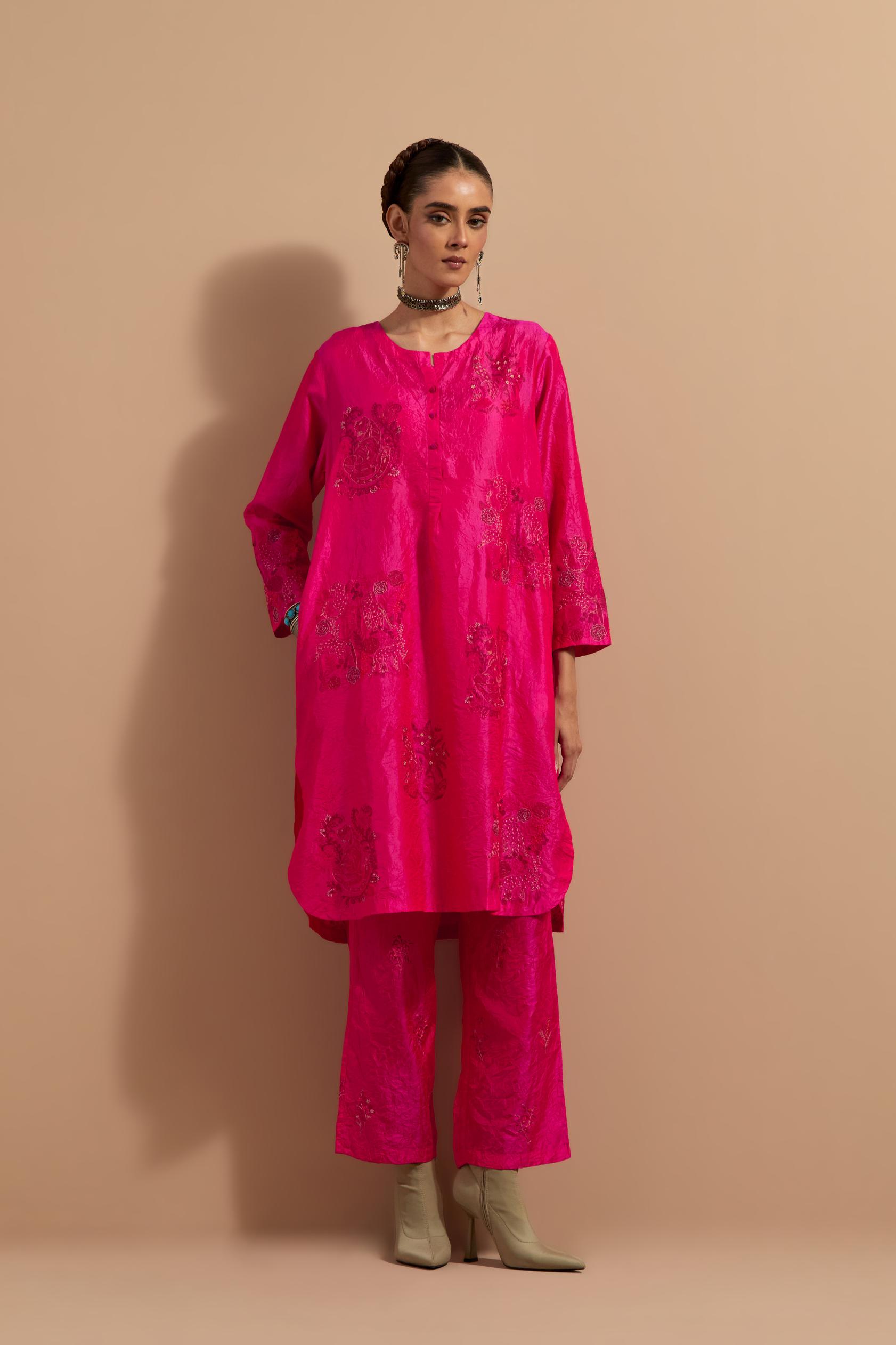 Fuchsia crushed silk short kurta set with hand block print, highlighted with multi colored thread embroidery.