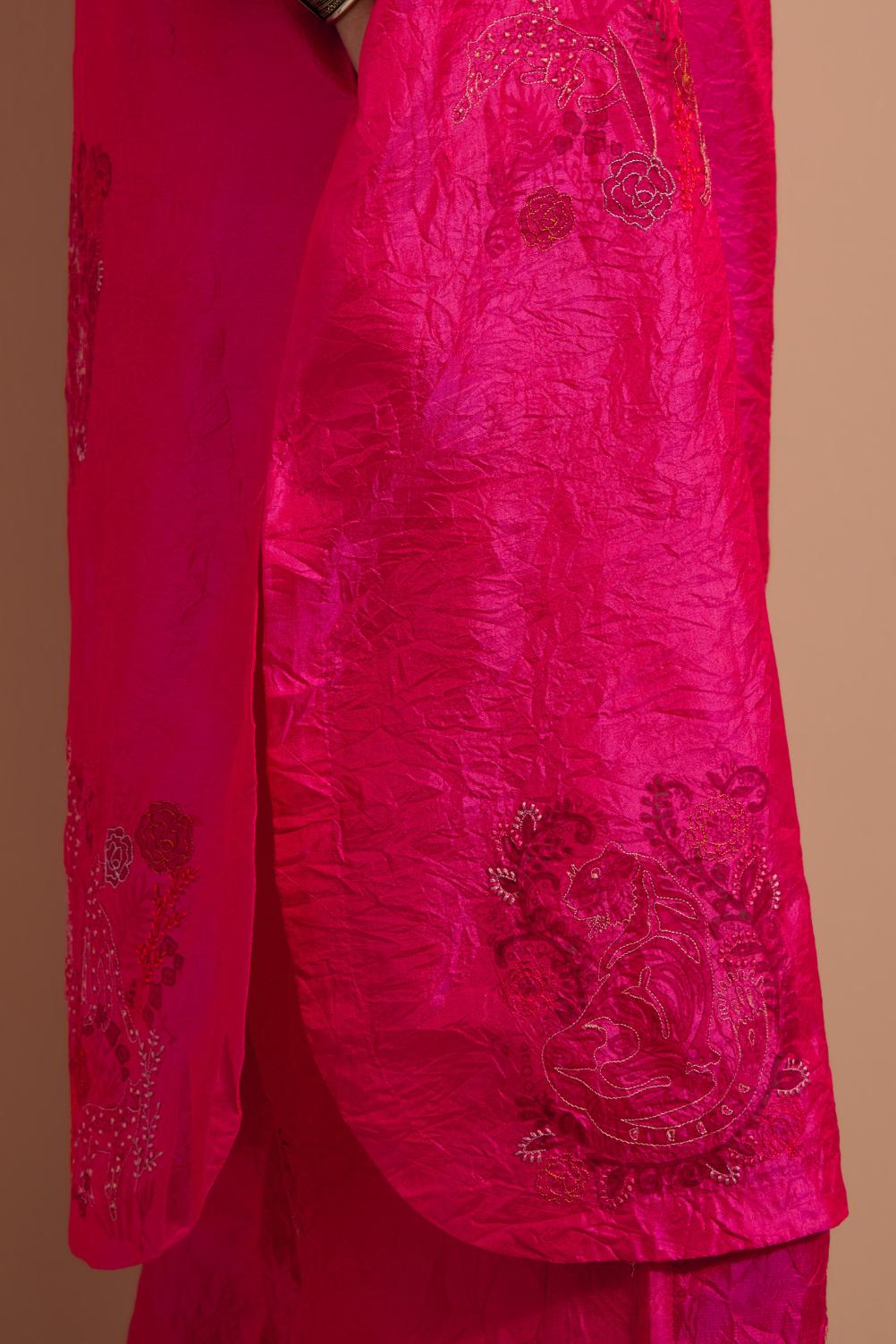 Fuchsia crushed silk short kurta set with hand block print, highlighted with multi colored thread embroidery.