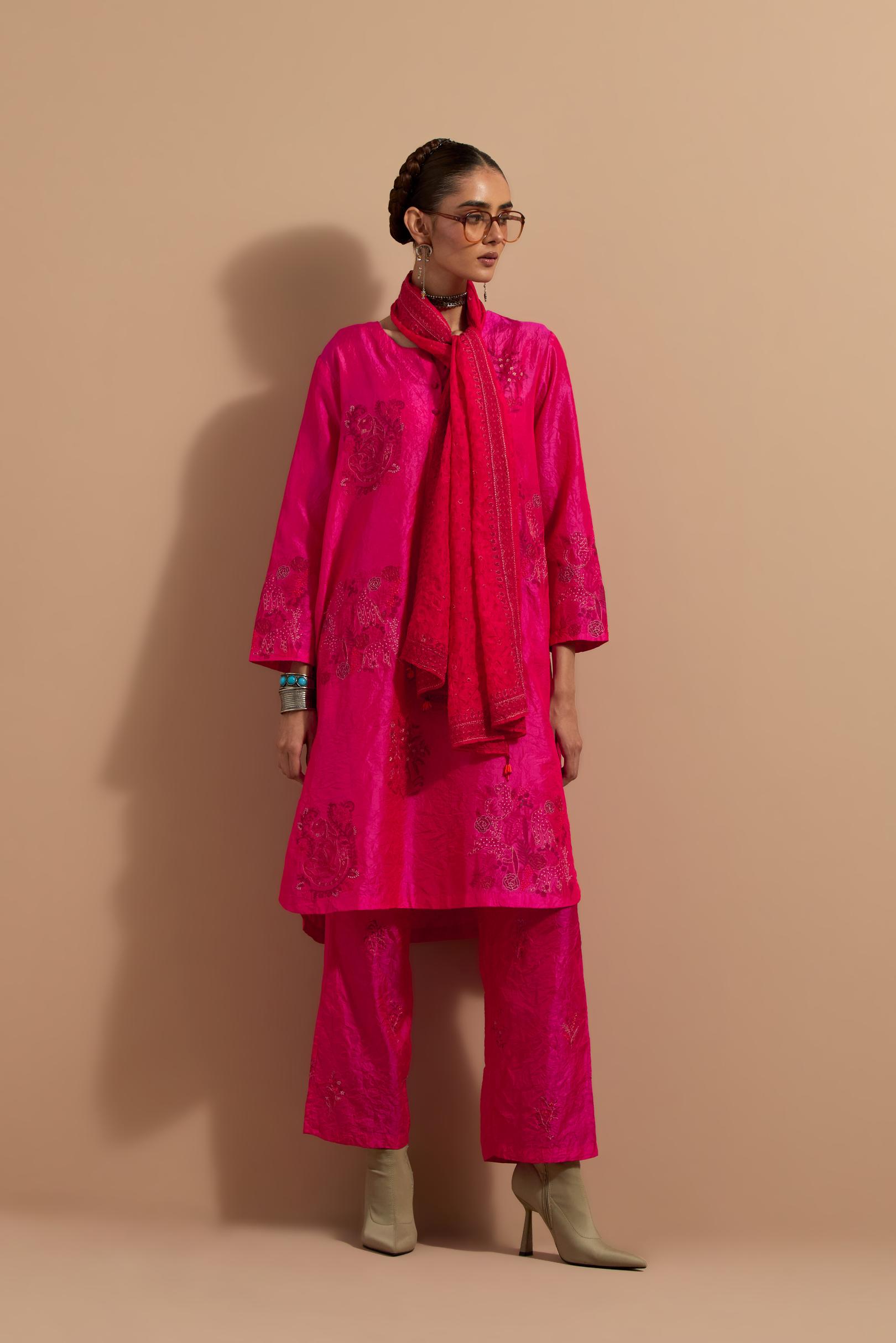 Fuchsia crushed silk short kurta set with hand block print, highlighted with multi colored thread embroidery.