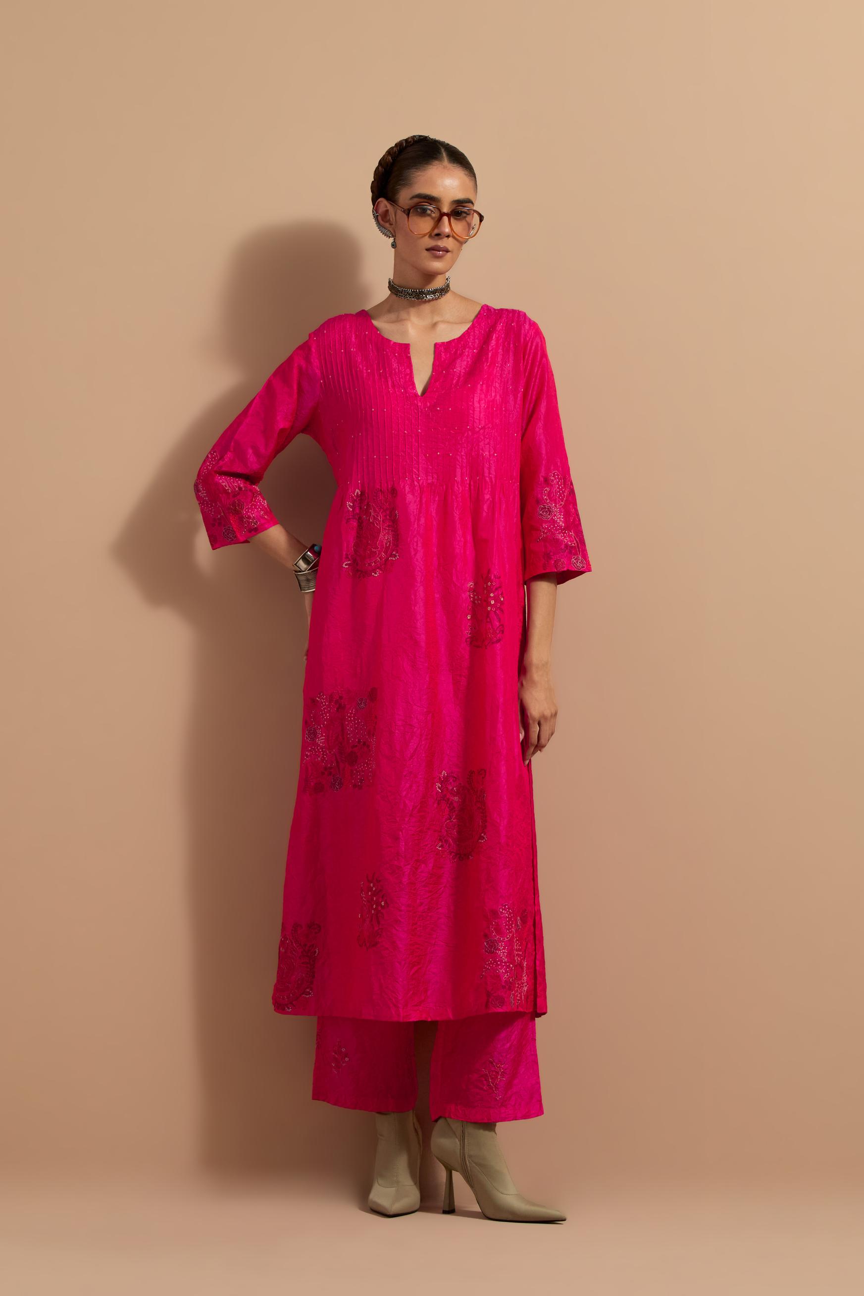 Fuchsia crushed silk hand block printed kurta set with pin tucks at yoke, highlighted with multi colored thread embroidery.