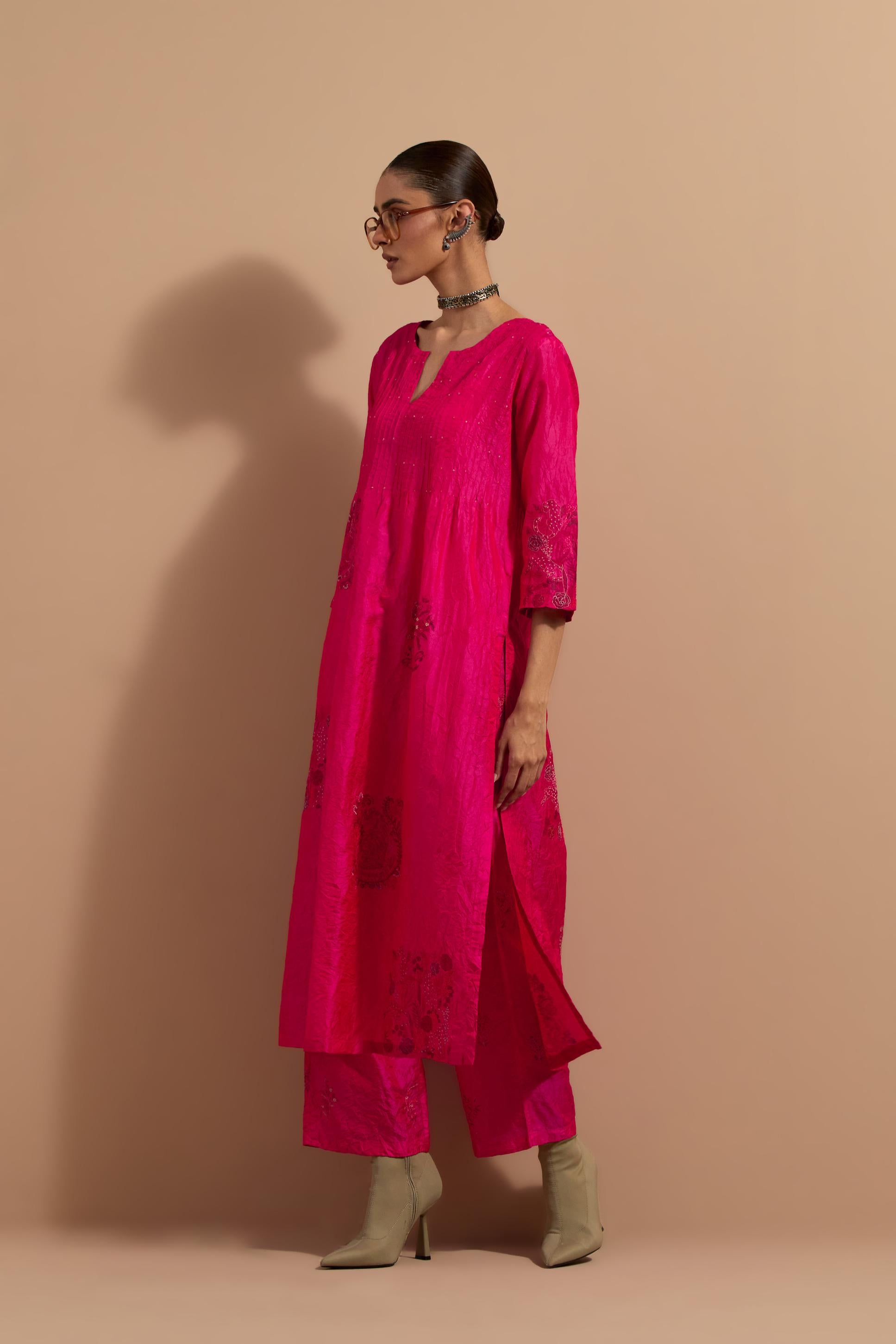 Fuchsia crushed silk hand block printed kurta set with pin tucks at yoke, highlighted with multi colored thread embroidery.