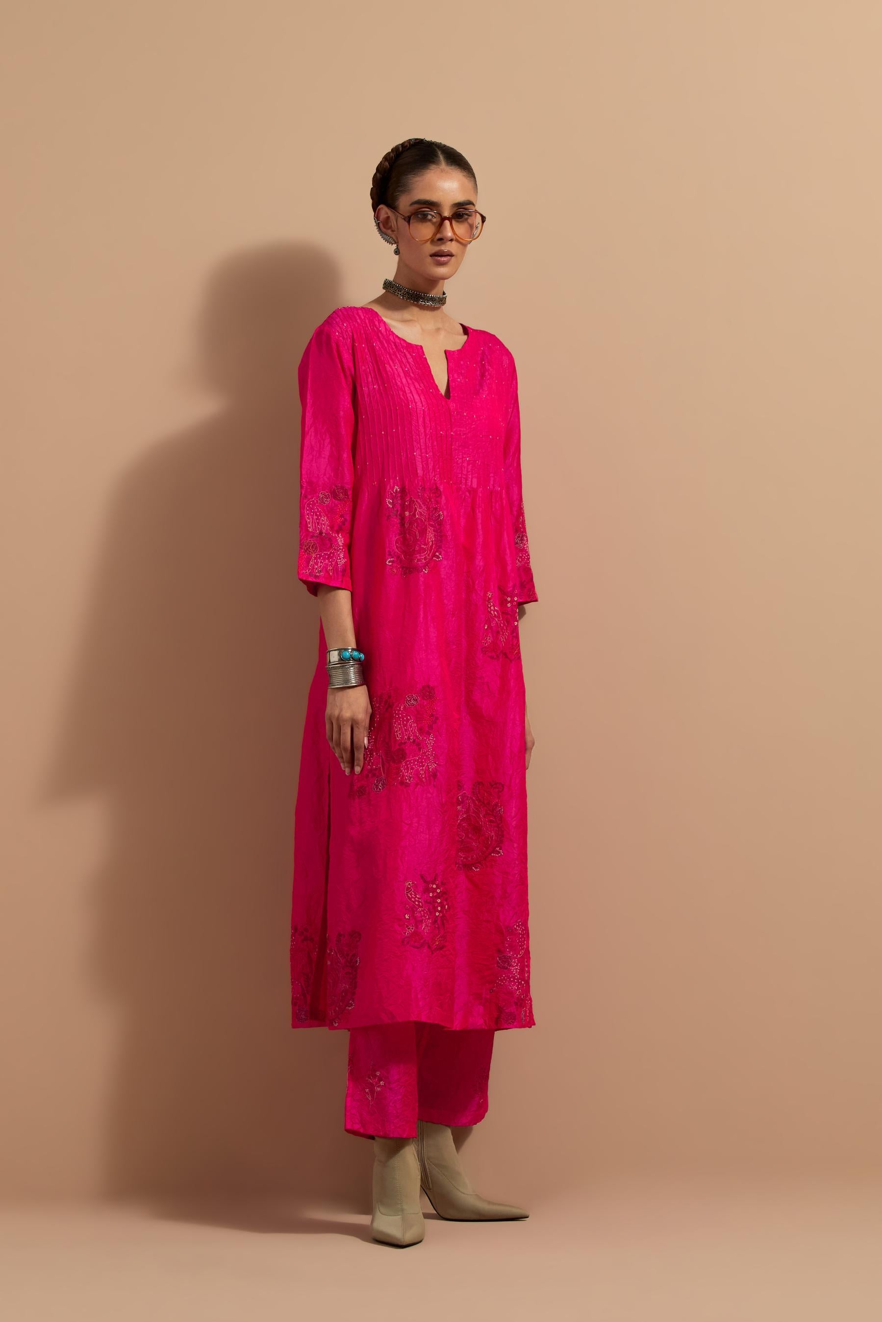 Fuchsia crushed silk hand block printed kurta set with pin tucks at yoke, highlighted with multi colored thread embroidery.