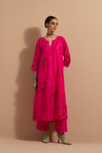 Fuchsia crushed silk hand block printed kurta set with pin tucks at yoke, highlighted with multi colored thread embroidery.