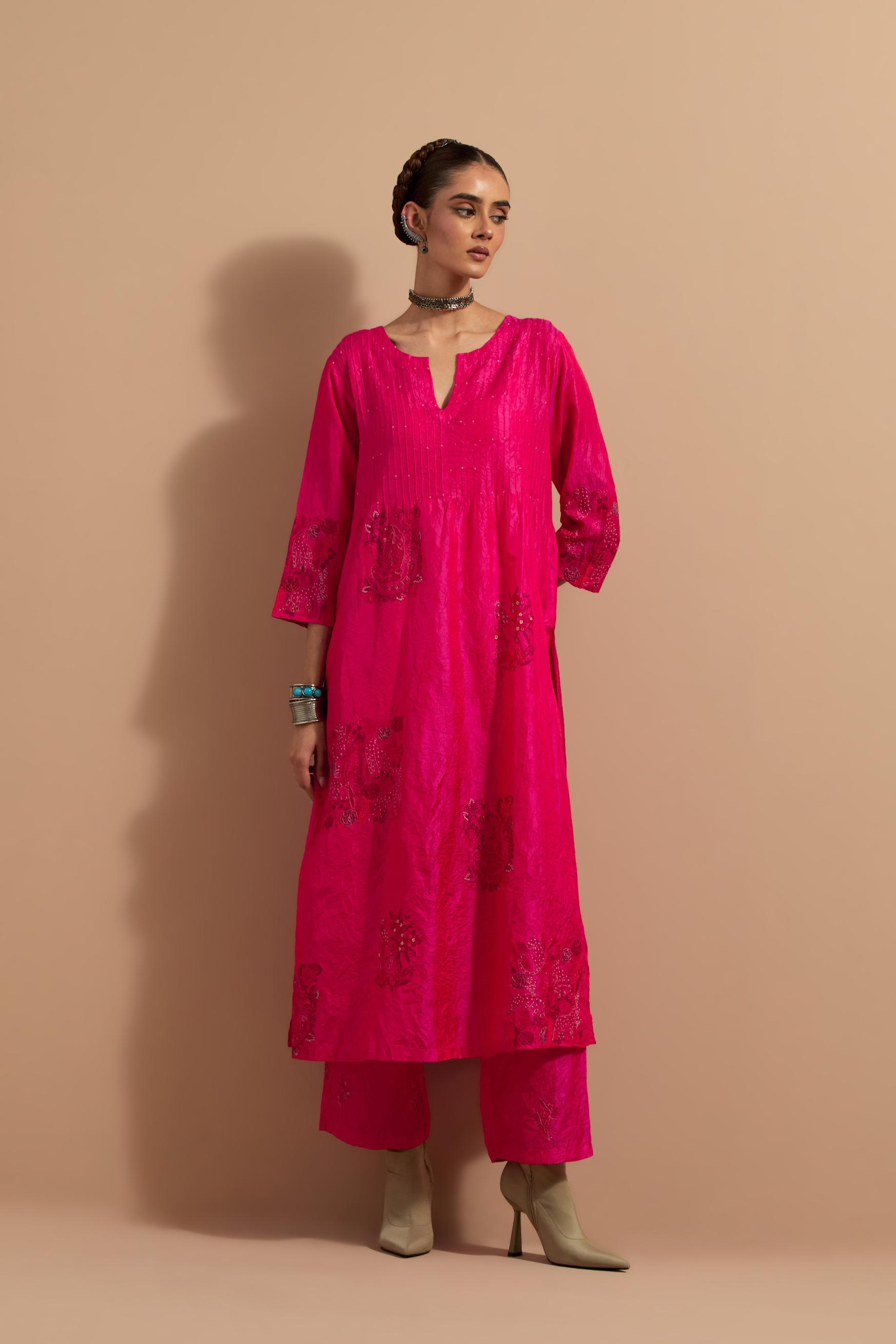 Fuchsia crushed silk hand block printed kurta set with pin tucks at yoke, highlighted with multi colored thread embroidery.