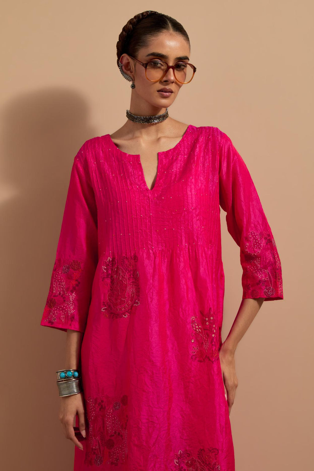 Fuchsia crushed silk hand block printed kurta set with pin tucks at yoke, highlighted with multi colored thread embroidery.