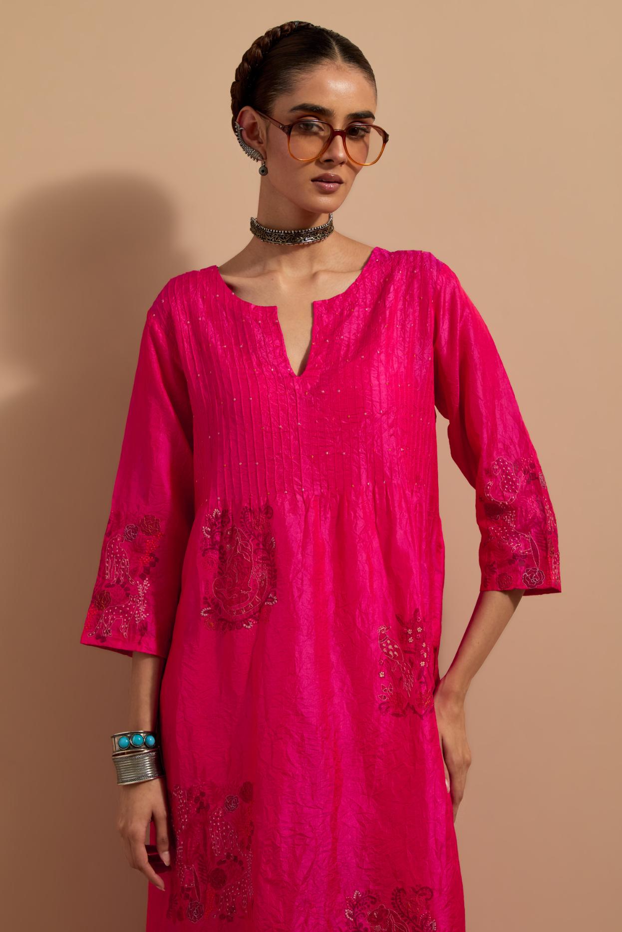 Fuchsia crushed silk hand block printed kurta set with pin tucks at yoke, highlighted with multi colored thread embroidery.