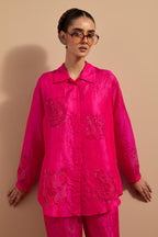 Fuchsia crushed silk hand block printed shirt, highlighted with multi colored thread embroidery, paired with Fuchsia crushed silk hand block printed pants, highlighted with multi colored thread embroidery.