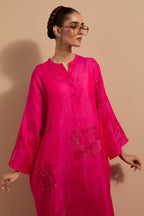 Fuchsia crushed silk hand block printed long kaftan, highlighted with multi colored thread embroidery, paired with Red hand crushed block printed silk stole with quilted embroidery and beaded tassels.