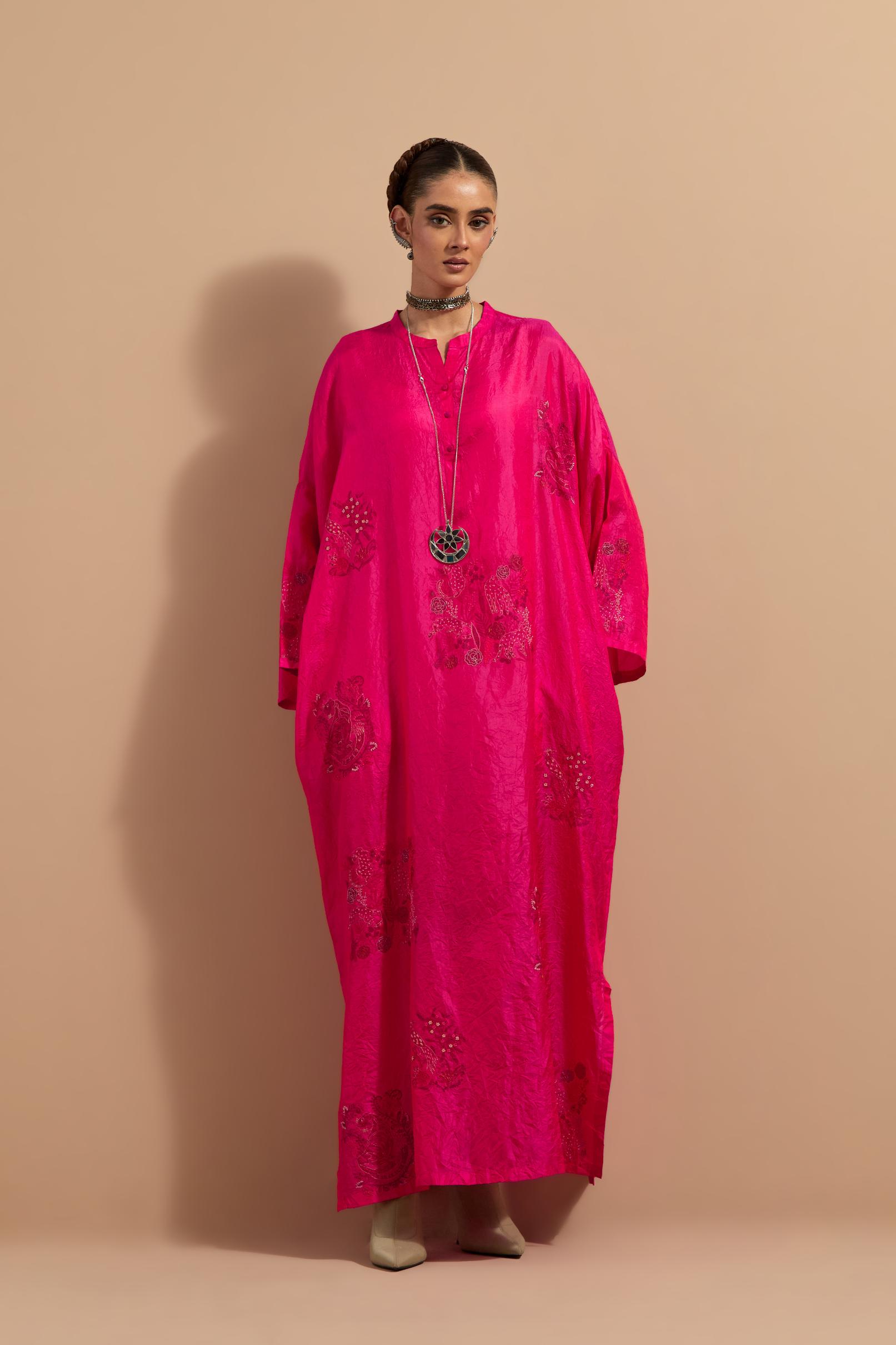 Fuchsia crushed silk hand block printed long kaftan, highlighted with multi colored thread embroidery, paired with Red hand crushed block printed silk stole with quilted embroidery and beaded tassels.