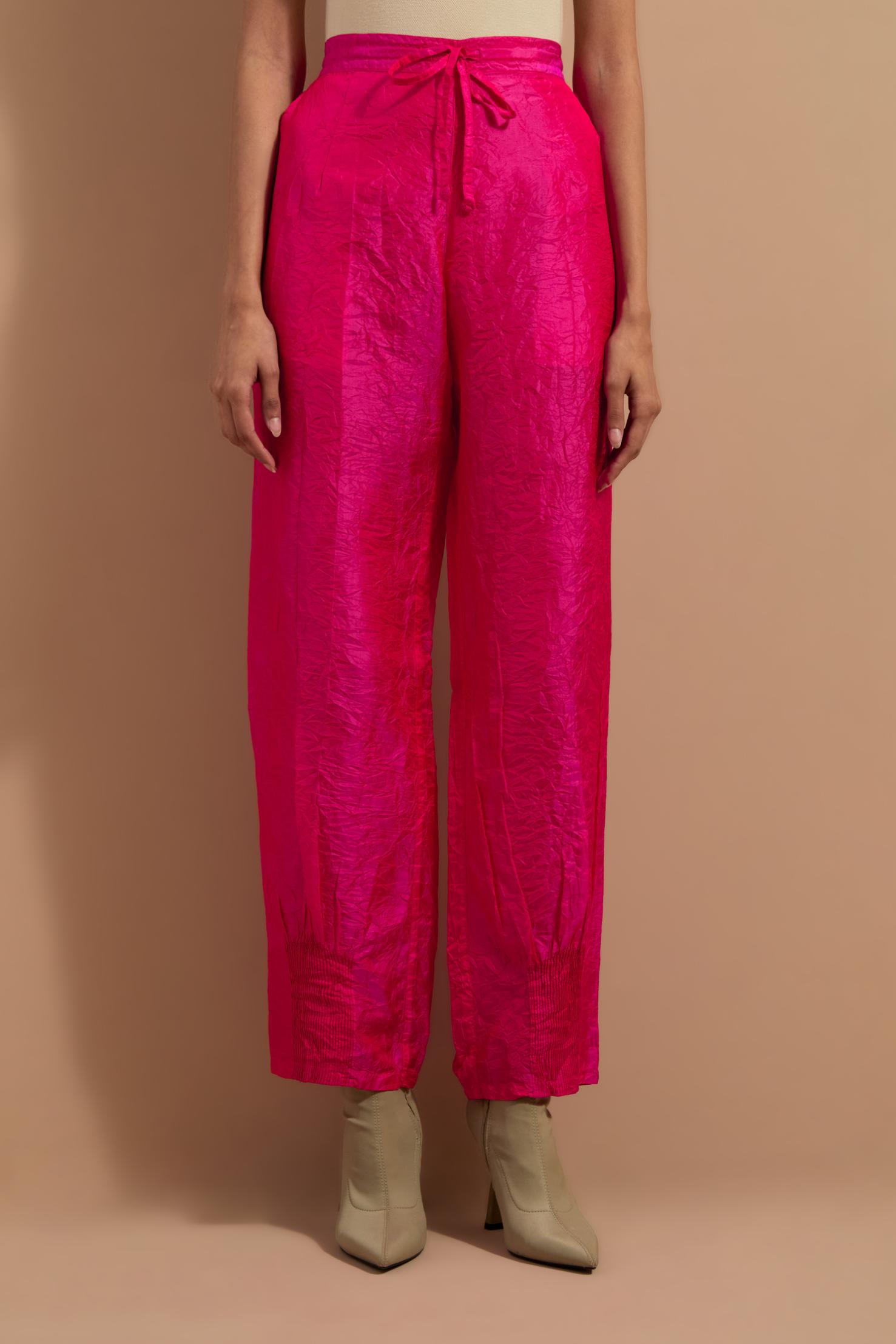 Fuchsia crushed silk hand block printed pants with pin tucks detailing at hem.