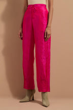 Fuchsia crushed silk hand block printed pants with pin tucks detailing at hem.