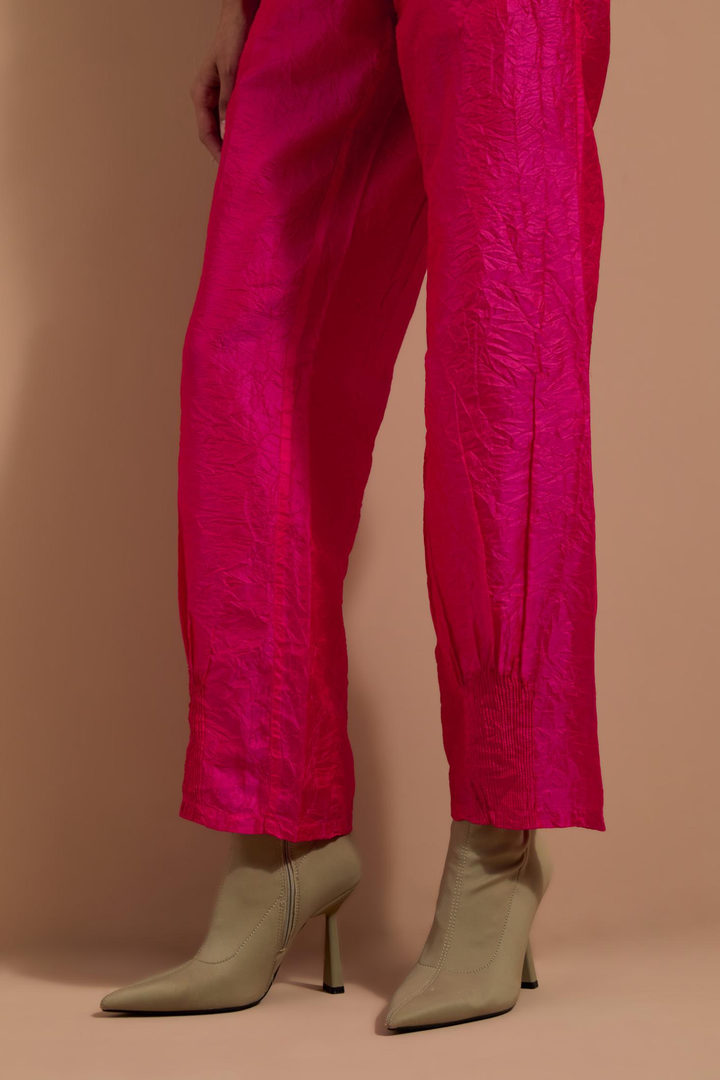 Fuchsia crushed silk hand block printed pants with pin tucks detailing at hem.