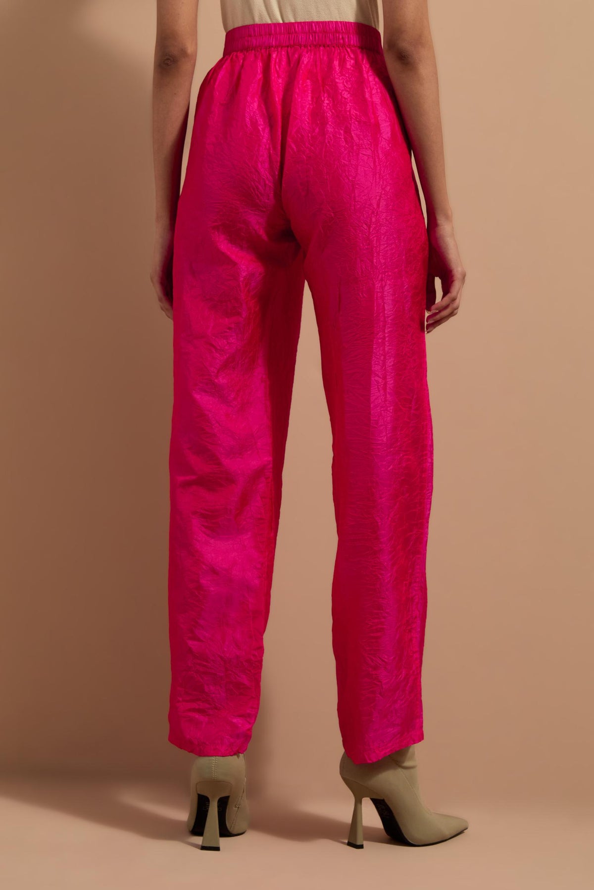 Fuchsia crushed silk hand block printed pants with pin tucks detailing at hem.