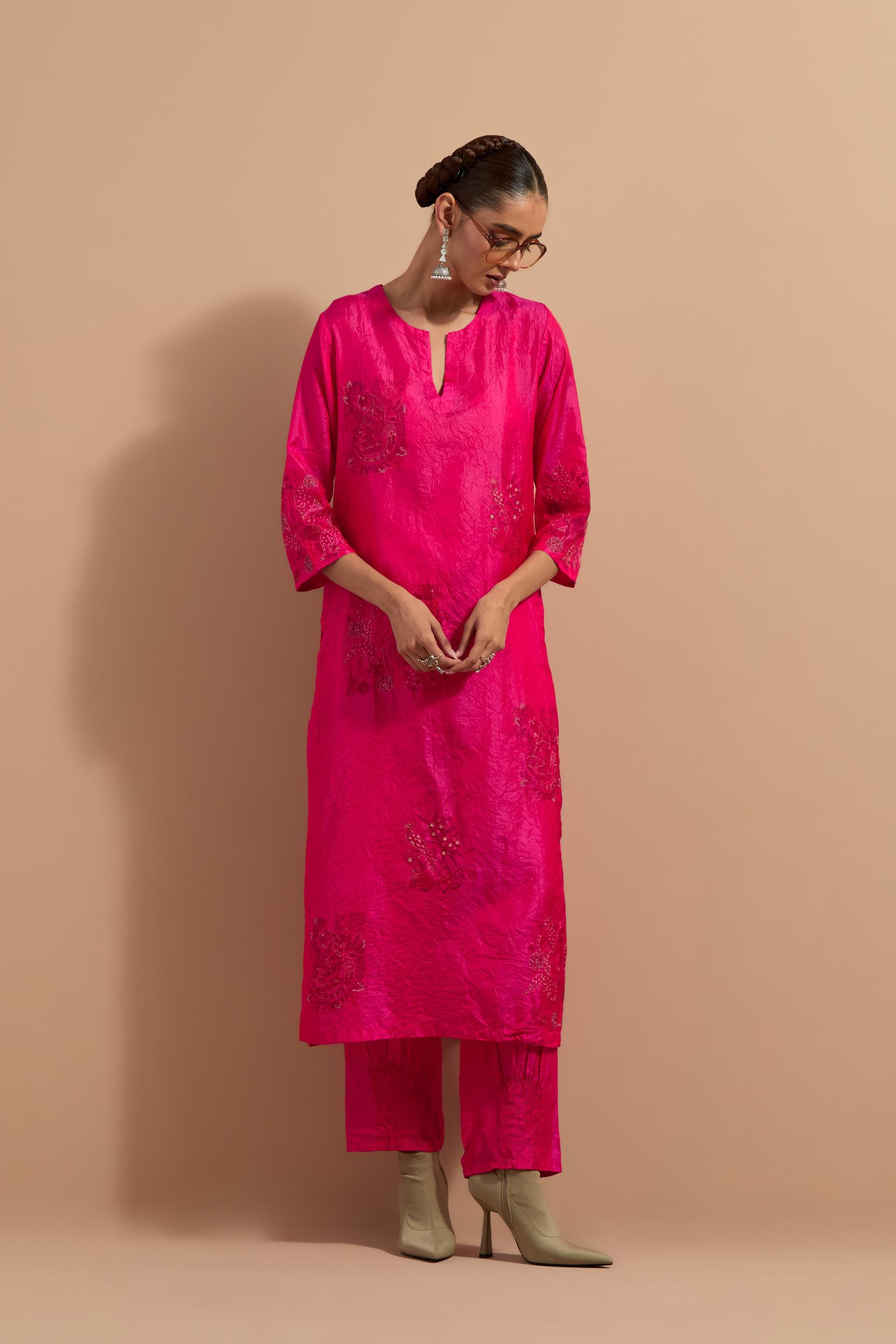 Fuchsia crushed silk hand block printed straight kurta set, highlighted with multi colored thread embroidery.