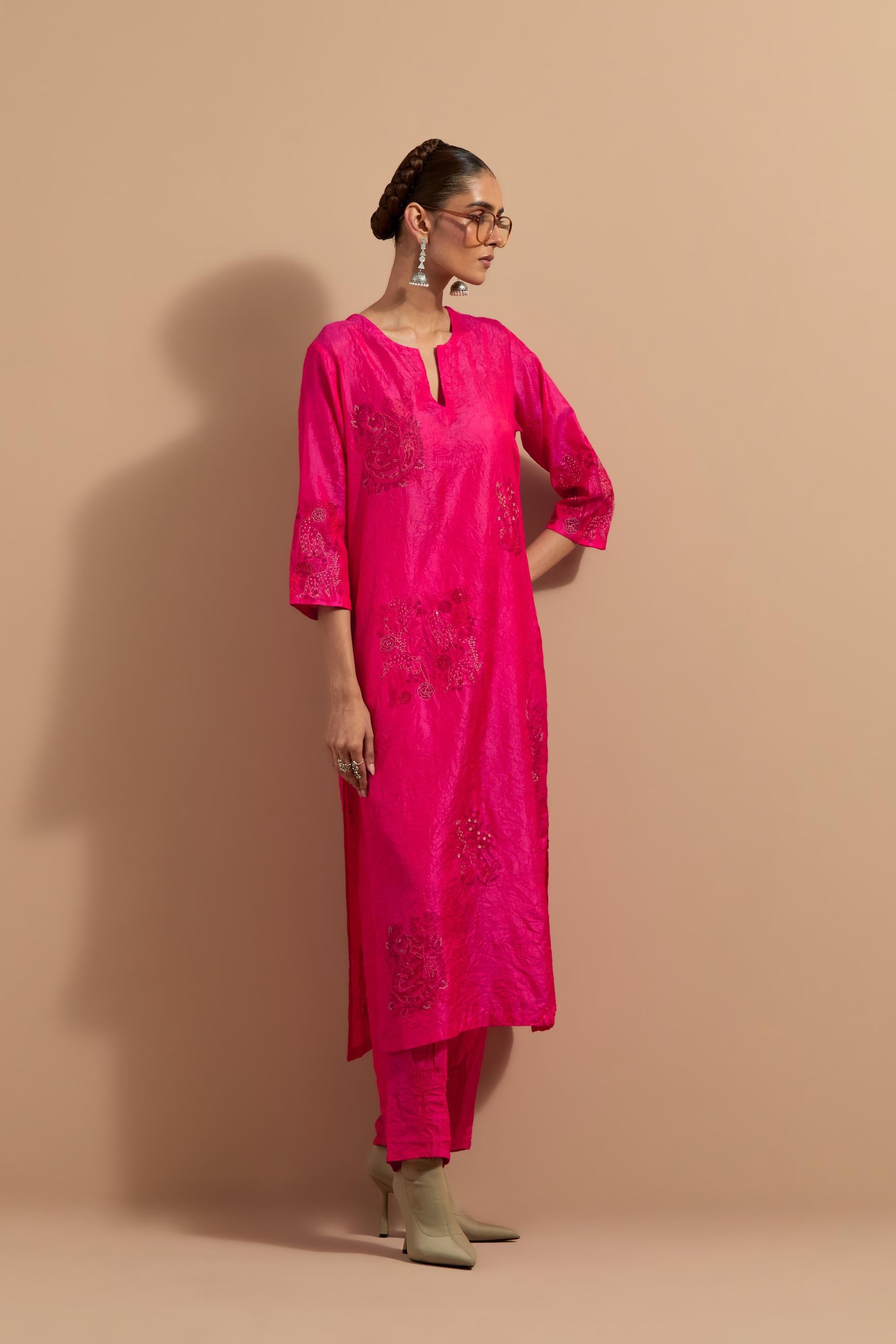 Fuchsia crushed silk hand block printed straight kurta set, highlighted with multi colored thread embroidery.