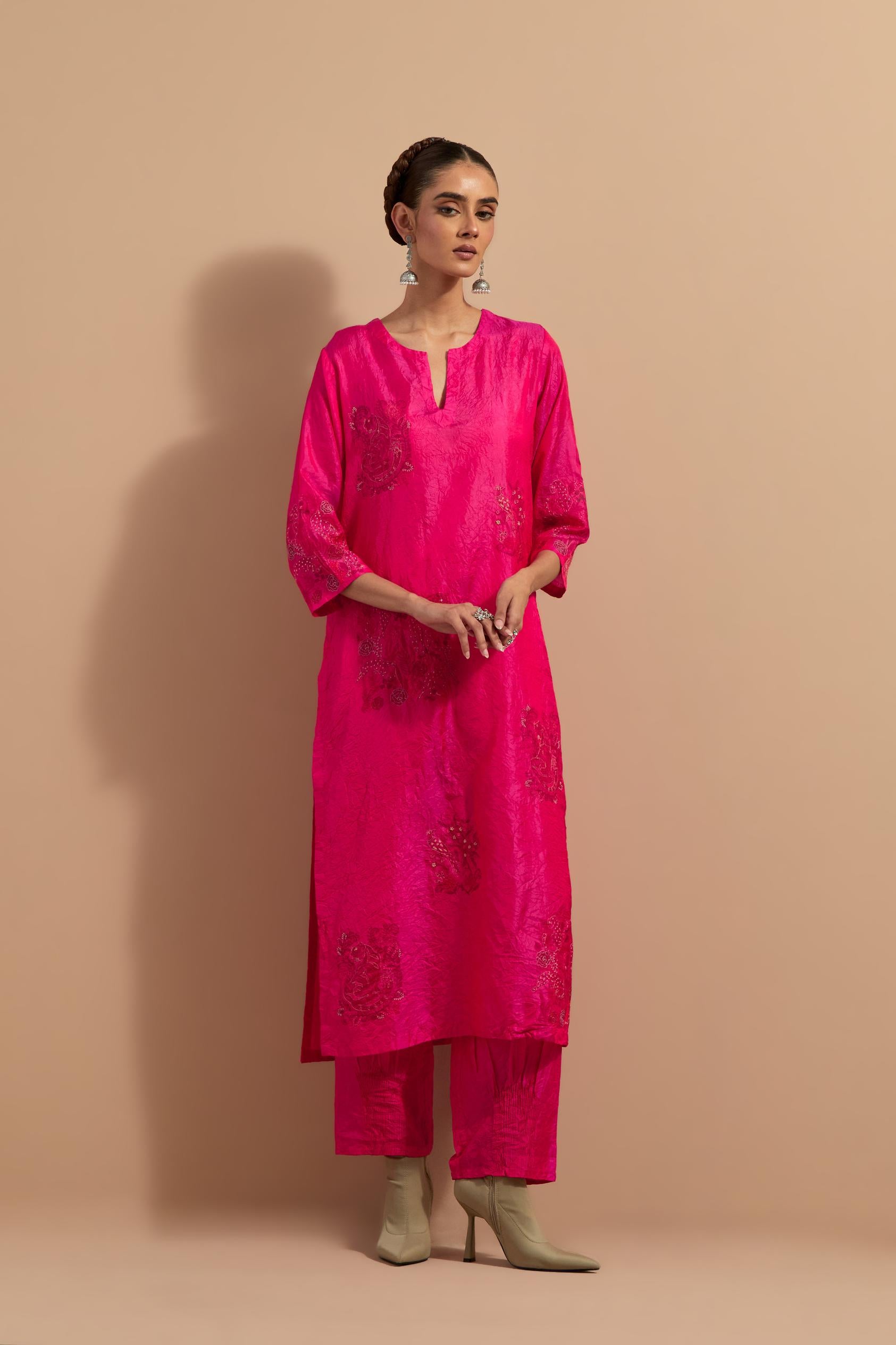 Fuchsia crushed silk hand block printed straight kurta set, highlighted with multi colored thread embroidery.