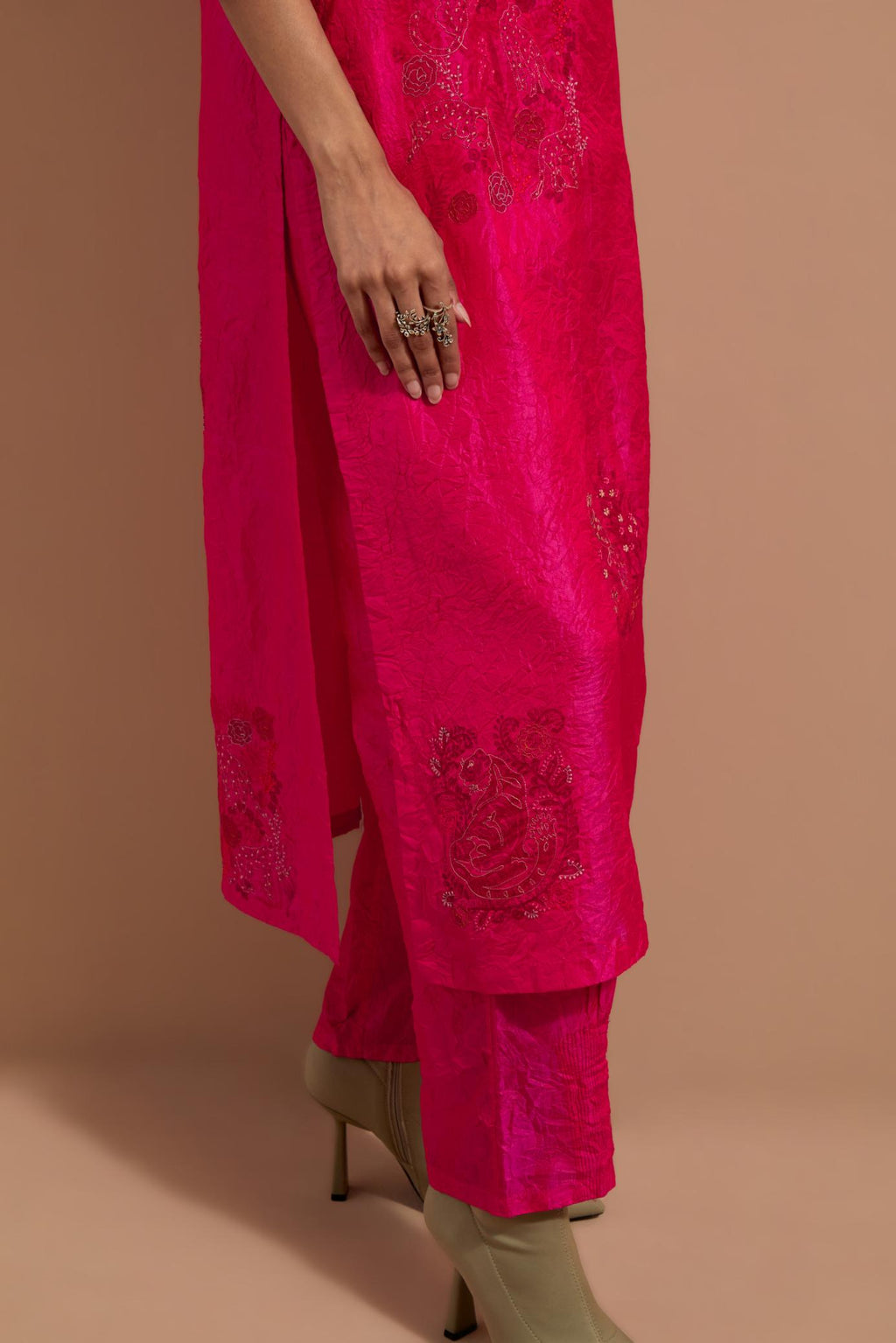 Fuchsia crushed silk hand block printed straight kurta set, highlighted with multi colored thread embroidery.