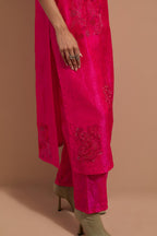 Fuchsia crushed silk hand block printed straight kurta set, highlighted with multi colored thread embroidery.