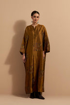 Olive crushed silk hand block printed long kaftan, highlighted with multi colored thread embroidery, paired with Red hand crushed block printed silk stole with quilted embroidery and beaded tassels.