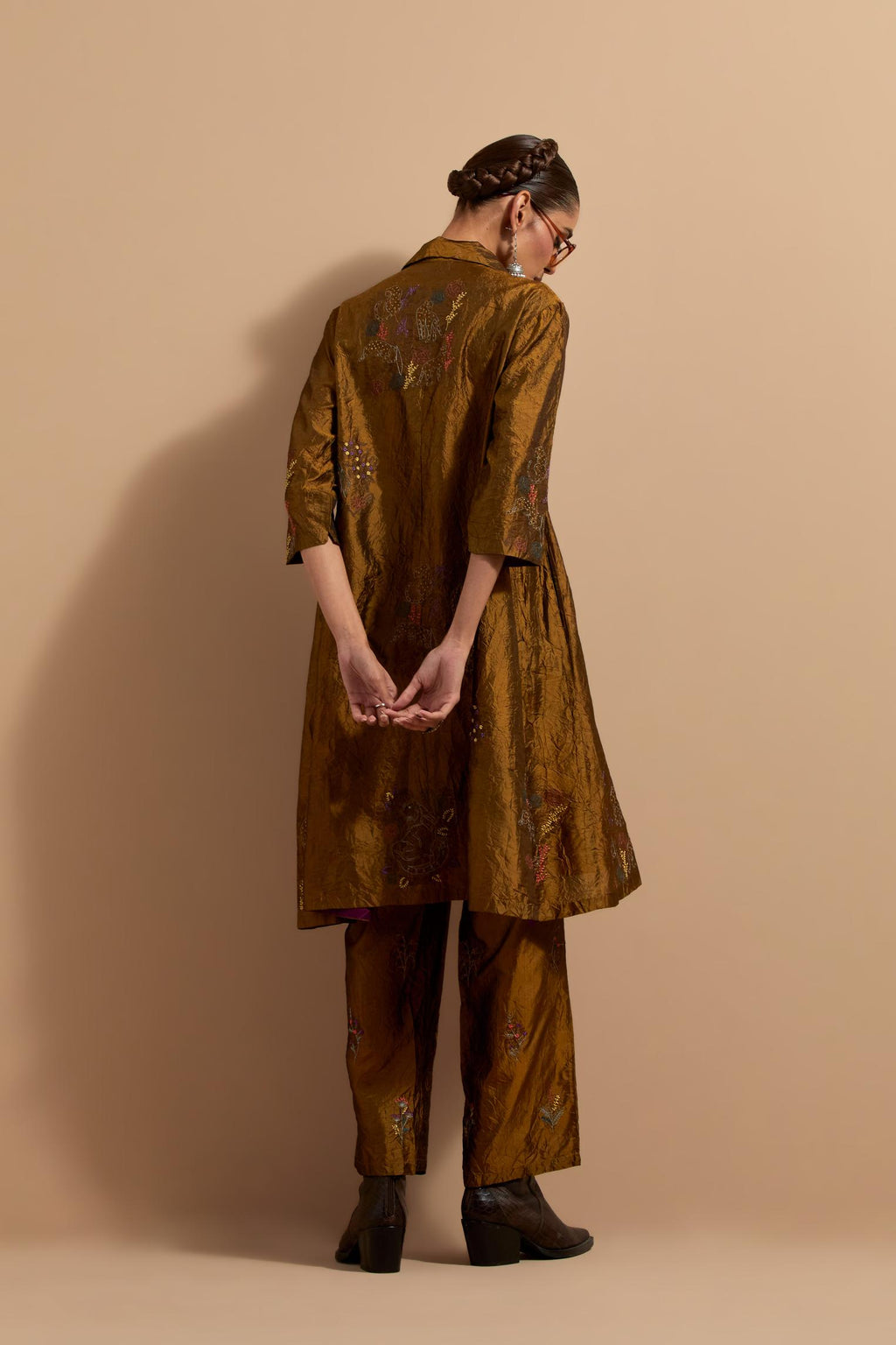 Olive crushed silk A-line short kurta set with hand block print, highlighted with multi colored thread embroidery.