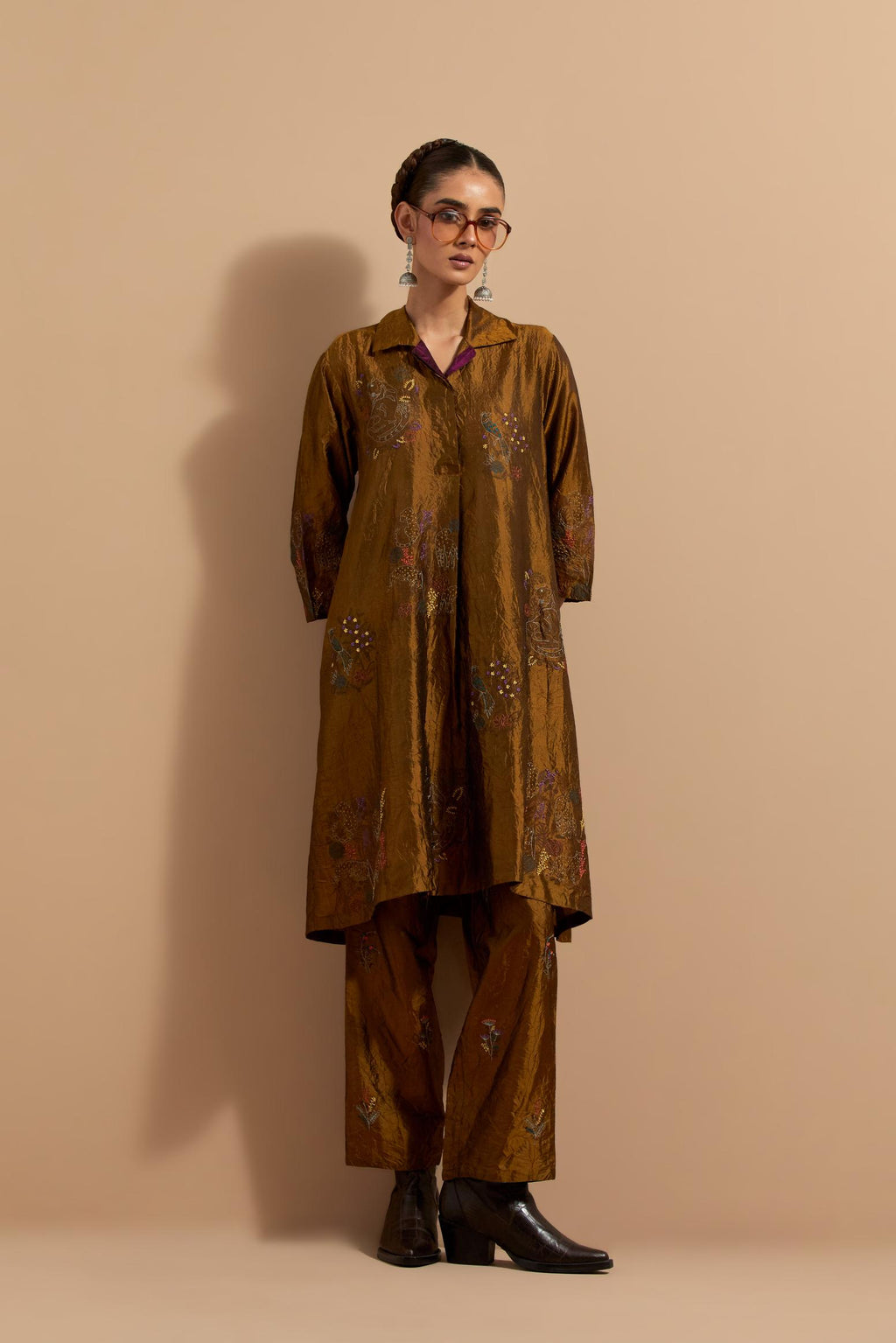 Olive crushed silk A-line short kurta set with hand block print, highlighted with multi colored thread embroidery.