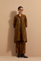 Olive crushed silk A-line short kurta set with hand block print, highlighted with multi colored thread embroidery.