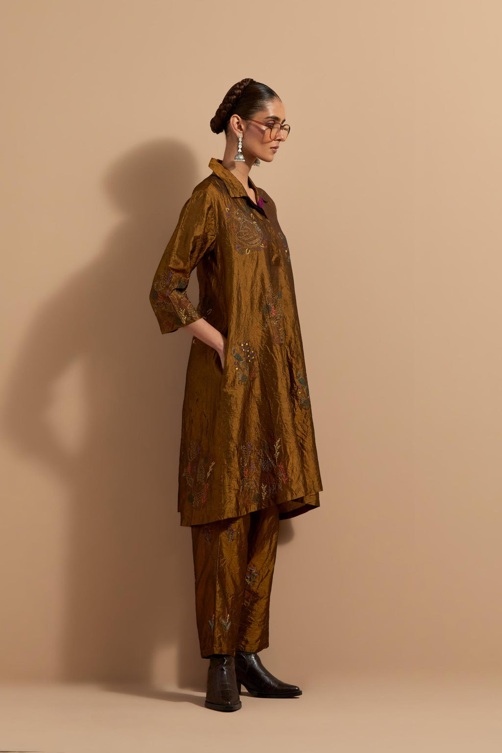 Olive crushed silk A-line short kurta set with hand block print, highlighted with multi colored thread embroidery.