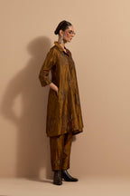 Olive crushed silk A-line short kurta set with hand block print, highlighted with multi colored thread embroidery.