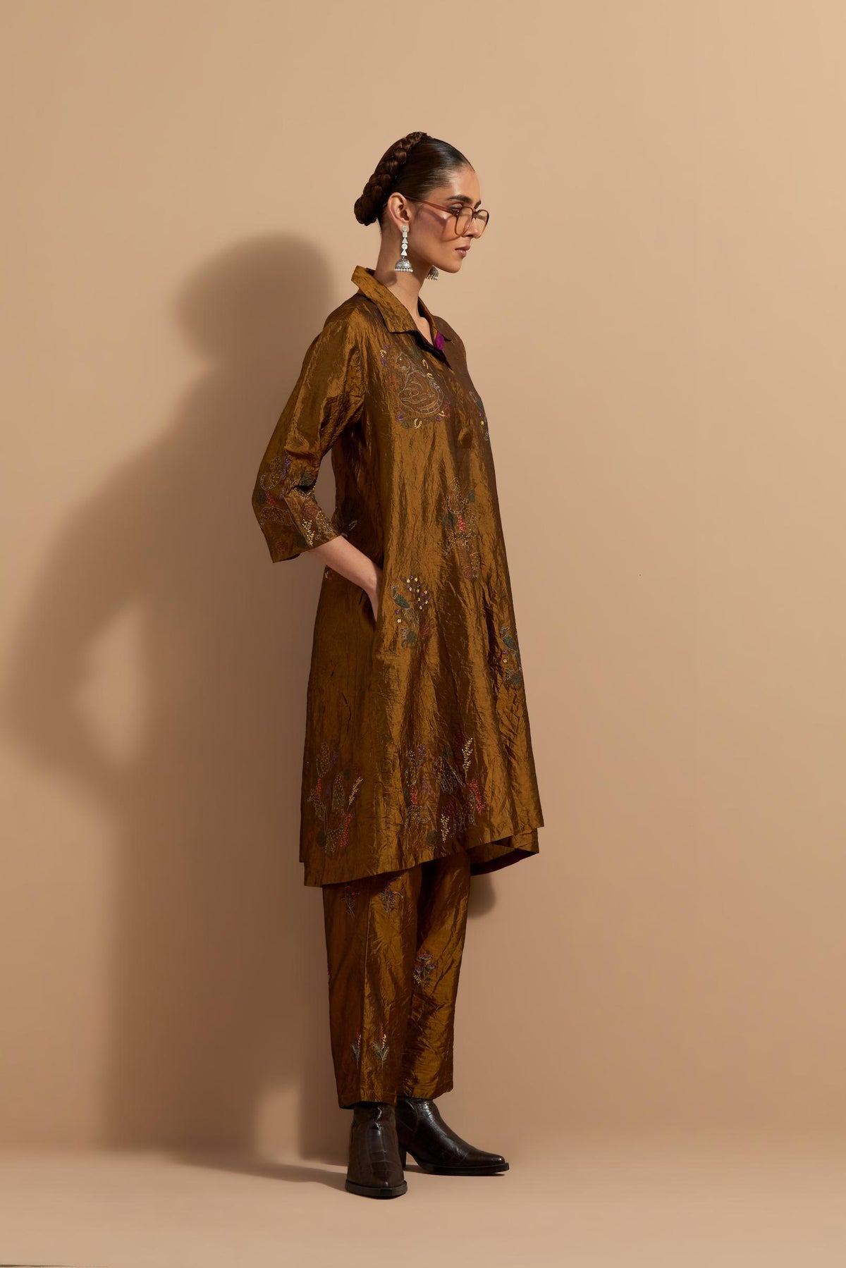 Olive crushed silk A-line short kurta set with hand block print, highlighted with multi colored thread embroidery.