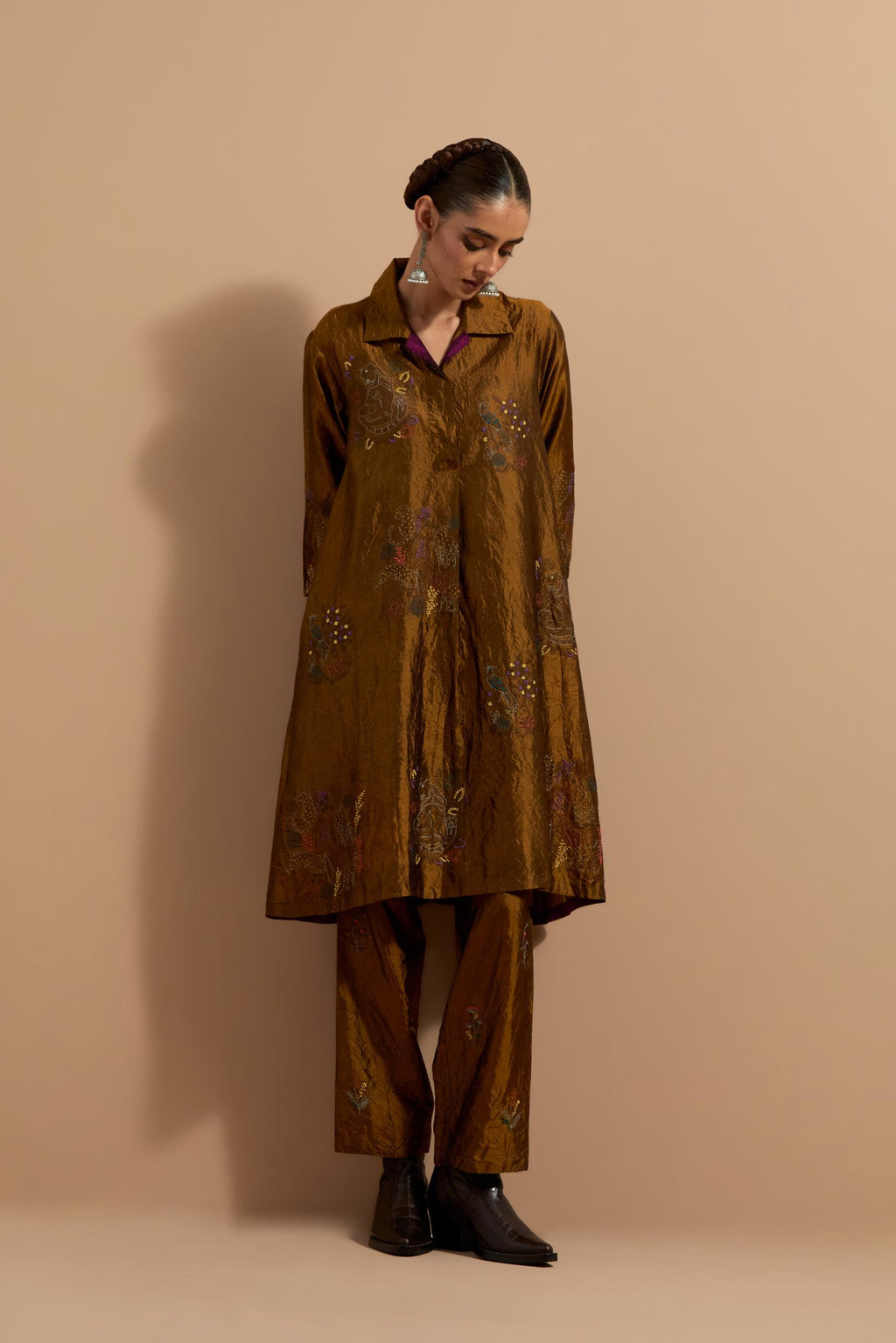 Olive crushed silk A-line short kurta set with hand block print, highlighted with multi colored thread embroidery.