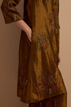 Olive crushed silk A-line short kurta set with hand block print, highlighted with multi colored thread embroidery.