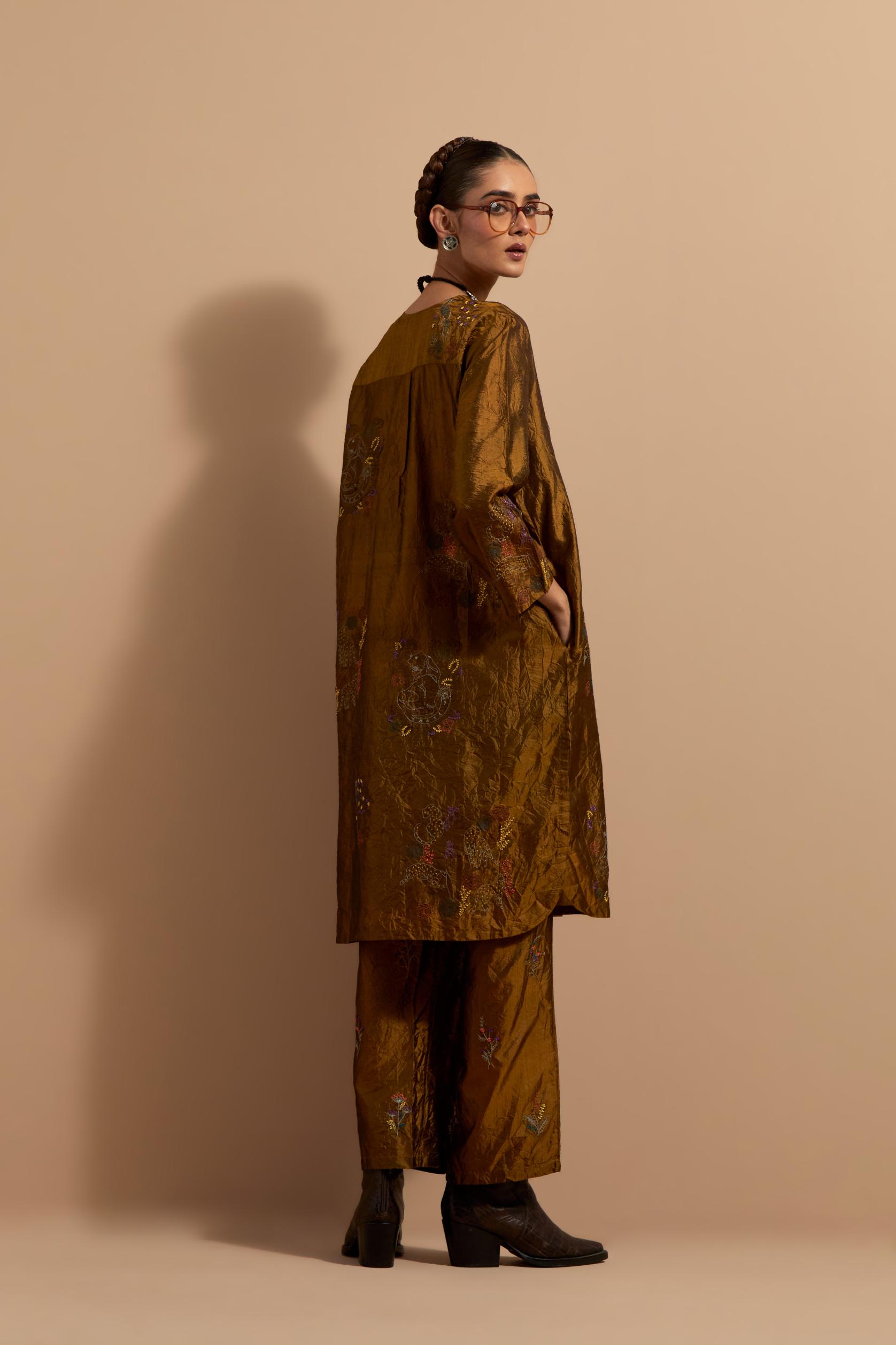 Olive crushed silk short kurta set with hand block print, highlighted with multi colored thread embroidery.