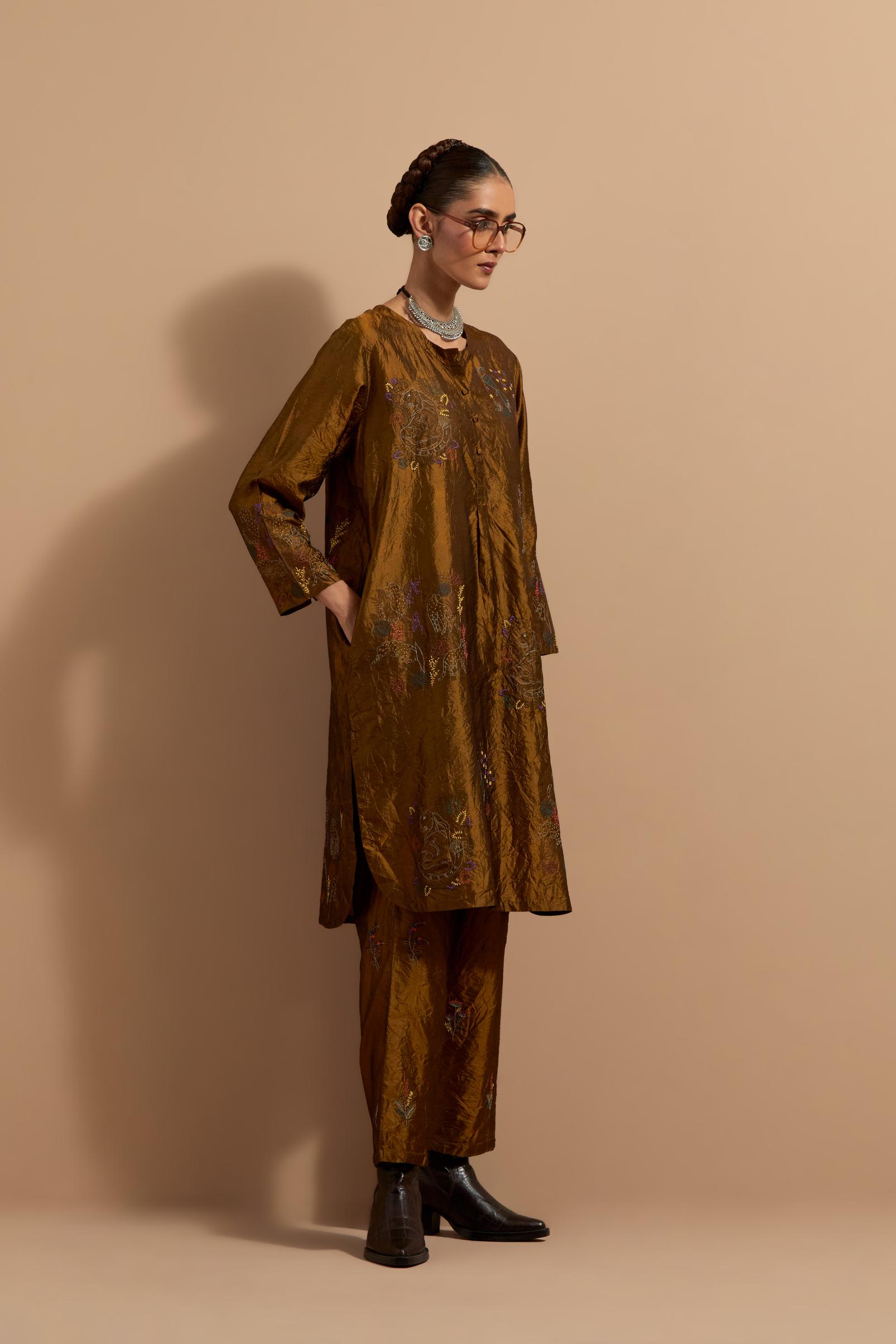 Olive crushed silk short kurta set with hand block print, highlighted with multi colored thread embroidery.