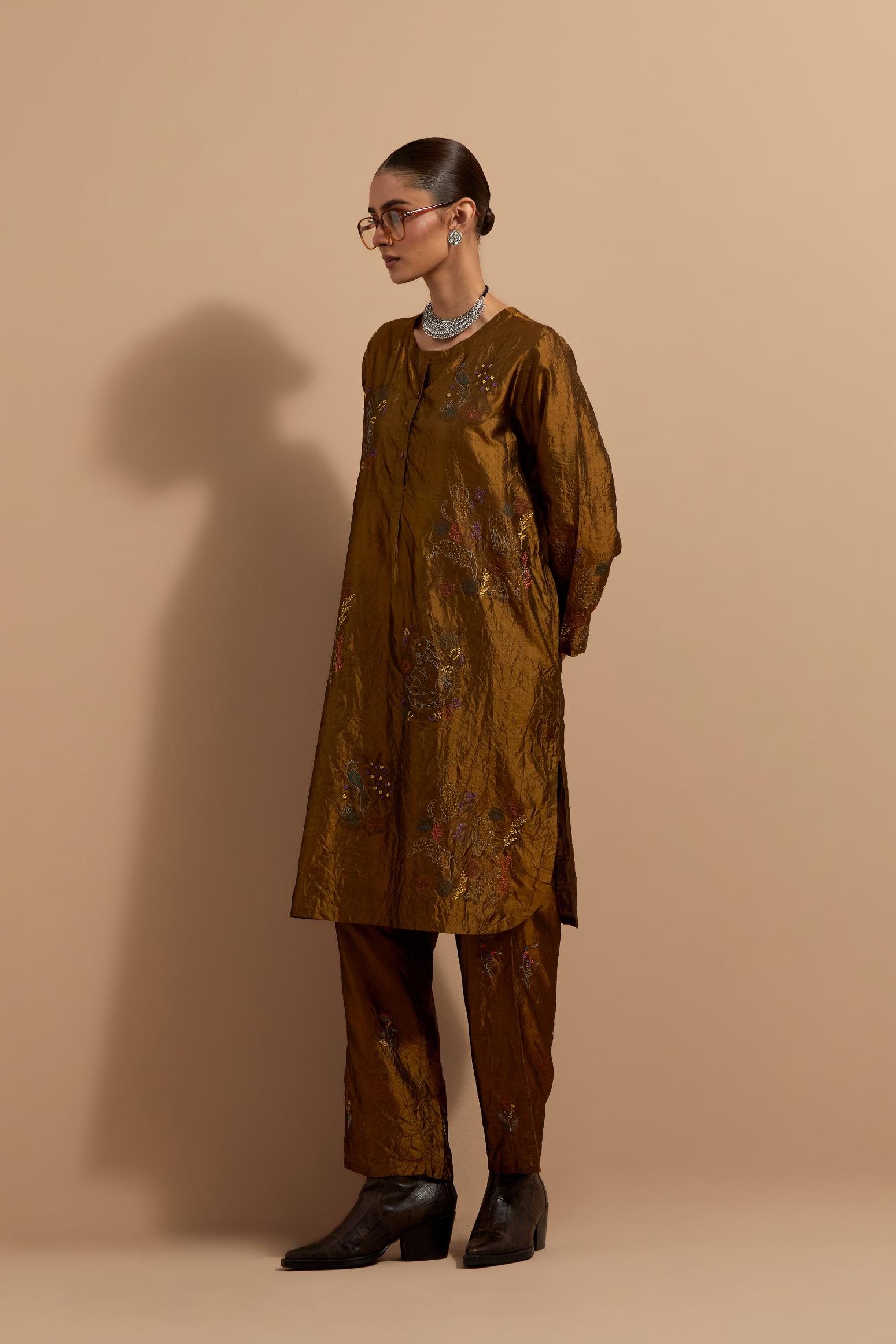 Olive crushed silk short kurta set with hand block print, highlighted with multi colored thread embroidery.