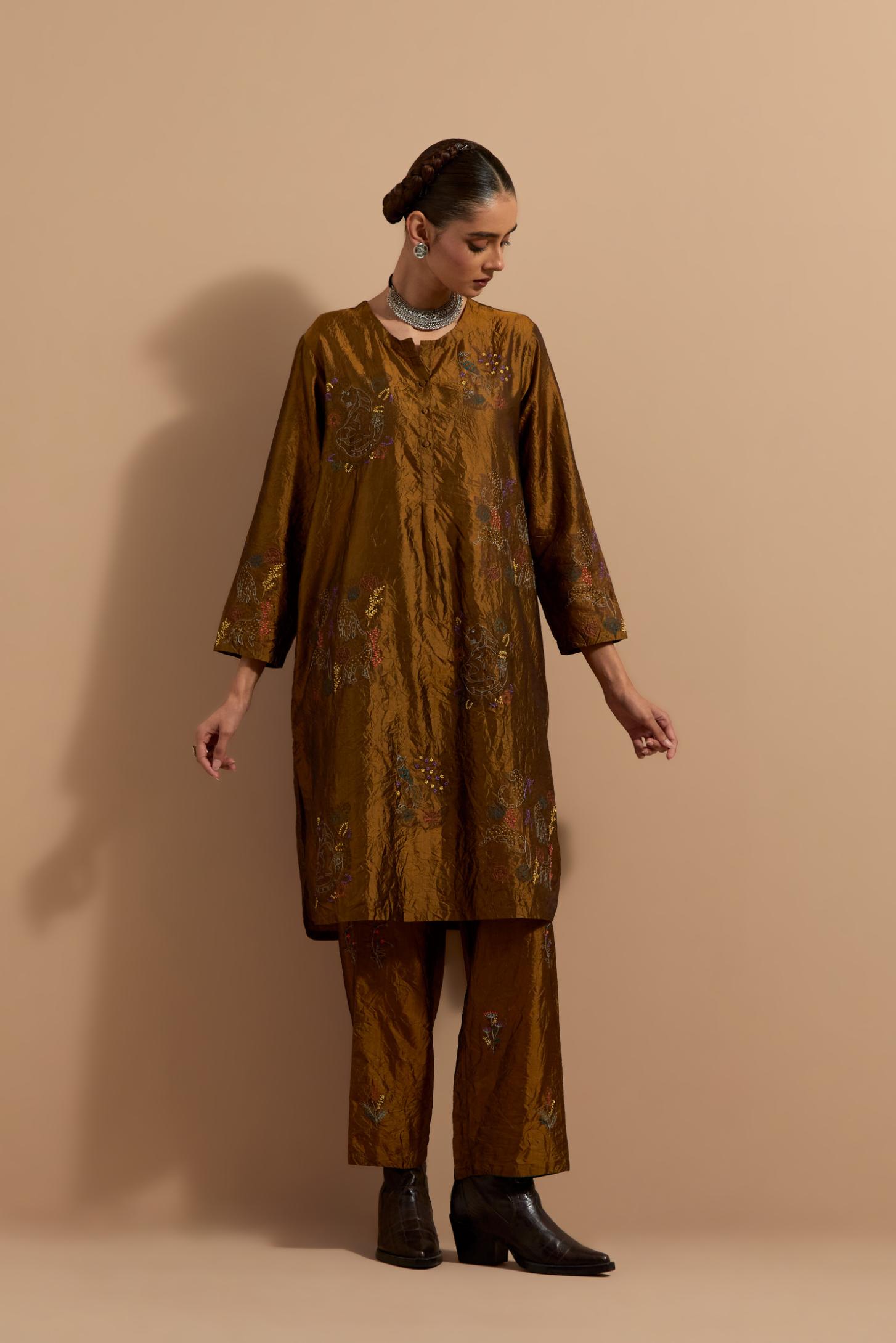 Olive crushed silk short kurta set with hand block print, highlighted with multi colored thread embroidery.