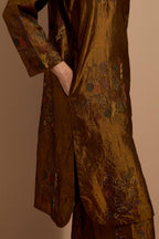 Olive crushed silk short kurta set with hand block print, highlighted with multi colored thread embroidery.