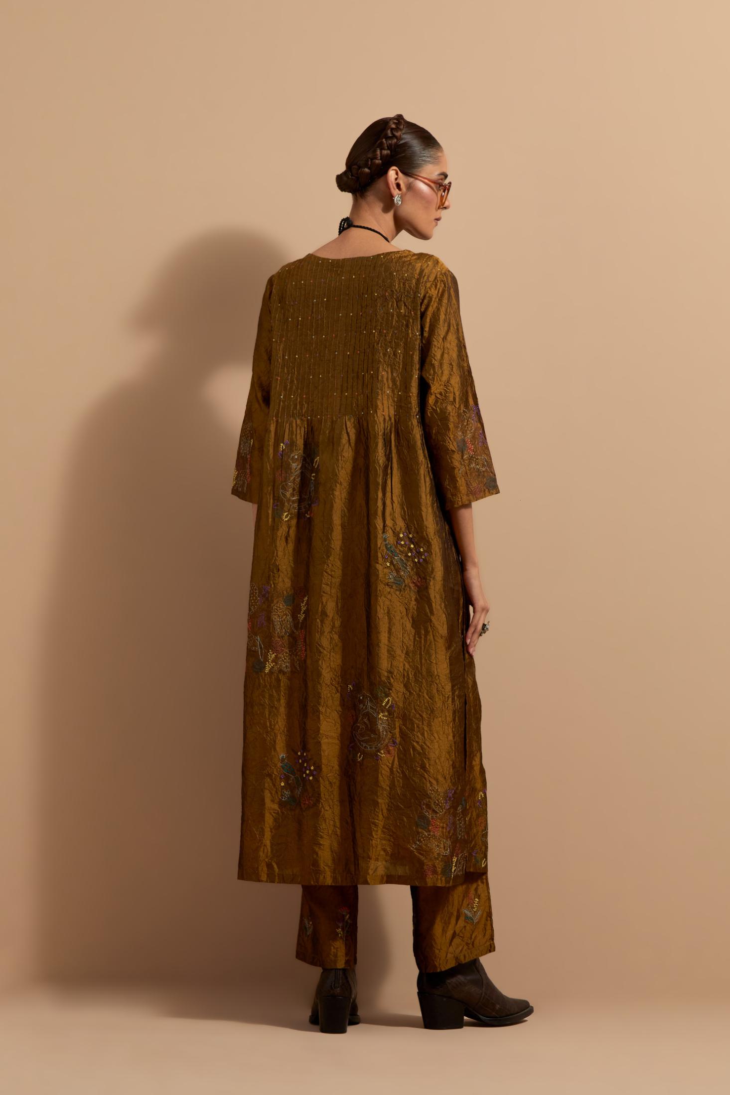 Olive crushed silk hand block printed kurta set with pin tucks at yoke, highlighted with multi colored thread embroidery.